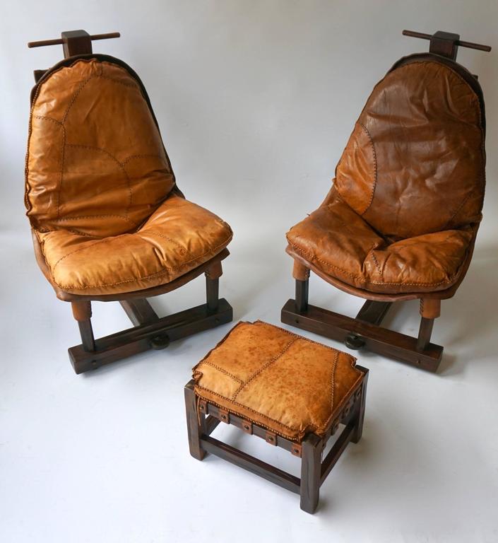 Note: Items individually available.

Very well kept Three-piece leather and wood Brazilian lounge set. The leather has a very nice soft feel and a warm patina. Structurally solid and ultra comfortable.

Measurements: (H x W x D).
Chairs: 74 x 96 x