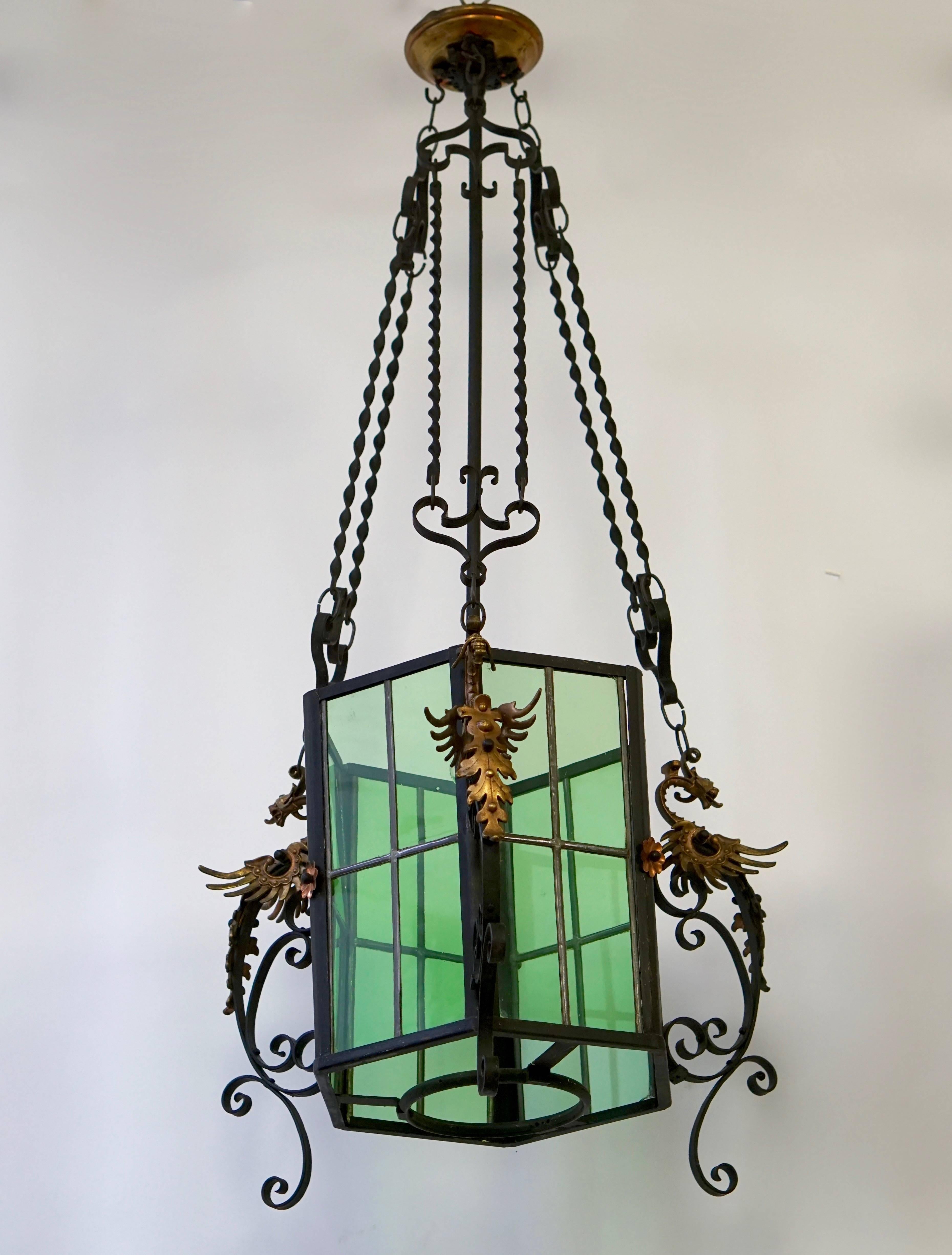 Awesome French lantern decorated with brass dragons.
Wrought iron mount with nice colored stained glass.
Measures: Diameter 55 cm,
total height 117 cm,
height fixture 35 cm.