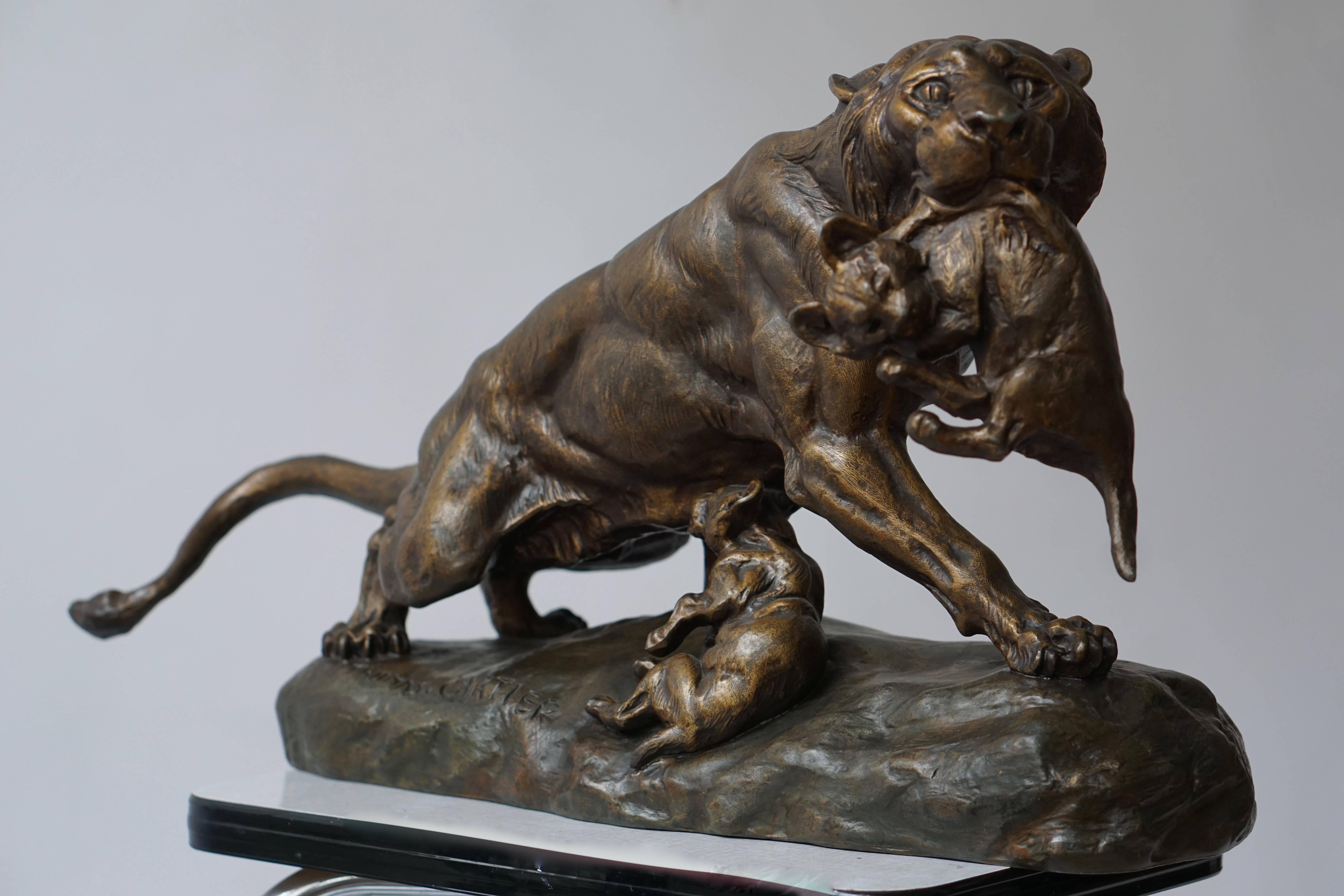  A gilt metal spelter lioness with her cubs, signed.THOMAS CARTIER  ( 1879 – 1943 ) 
Style: Art Deco.
Date: 1930.