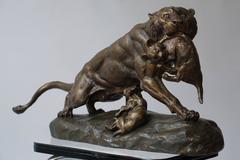 A Gilt Spelter Lioness with her Cubs, Signed Thomas Cartier