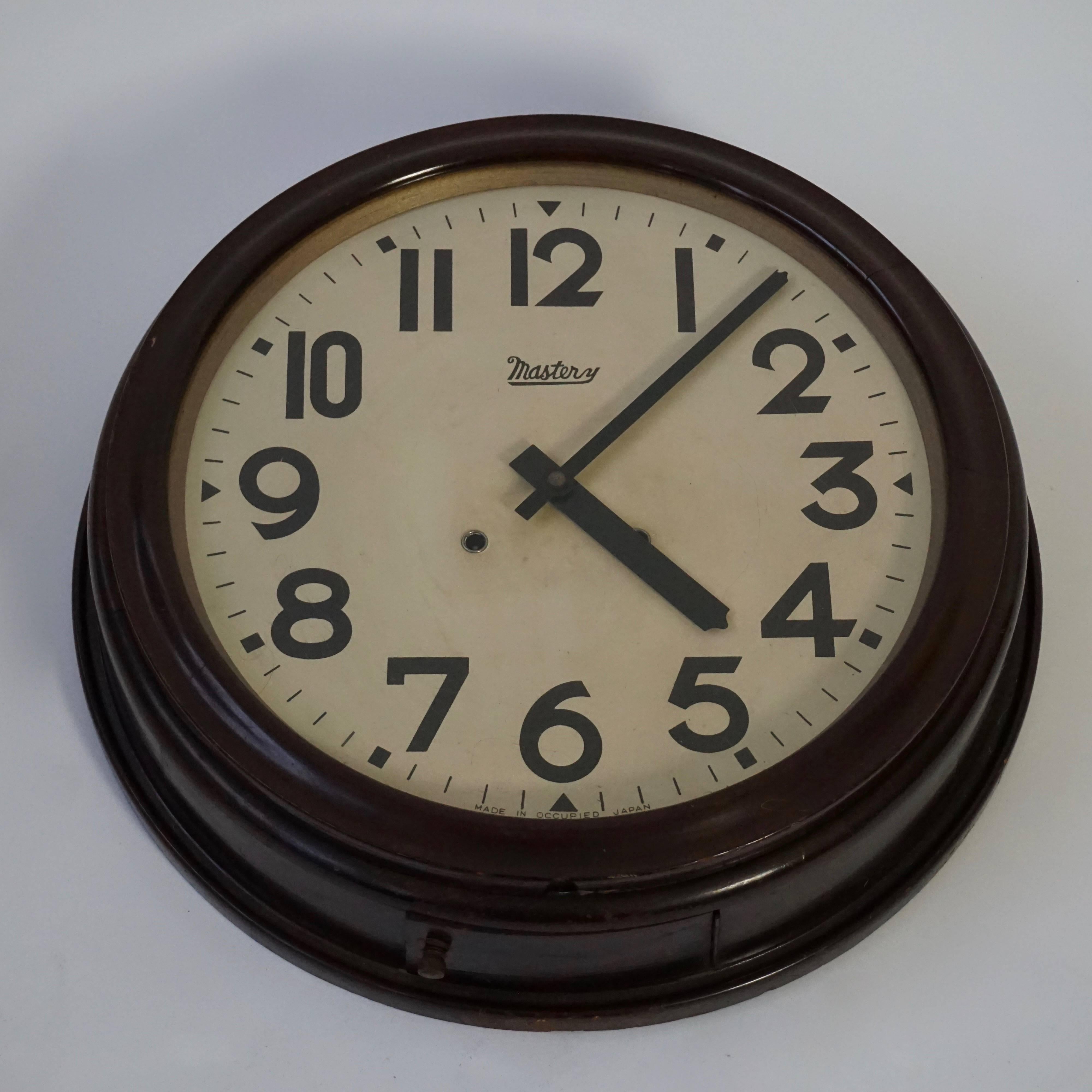 A wooden wall clock dating to the 1945-1952 made during the Japanese occupation. Including winding key.
Diameter: 51 cm.