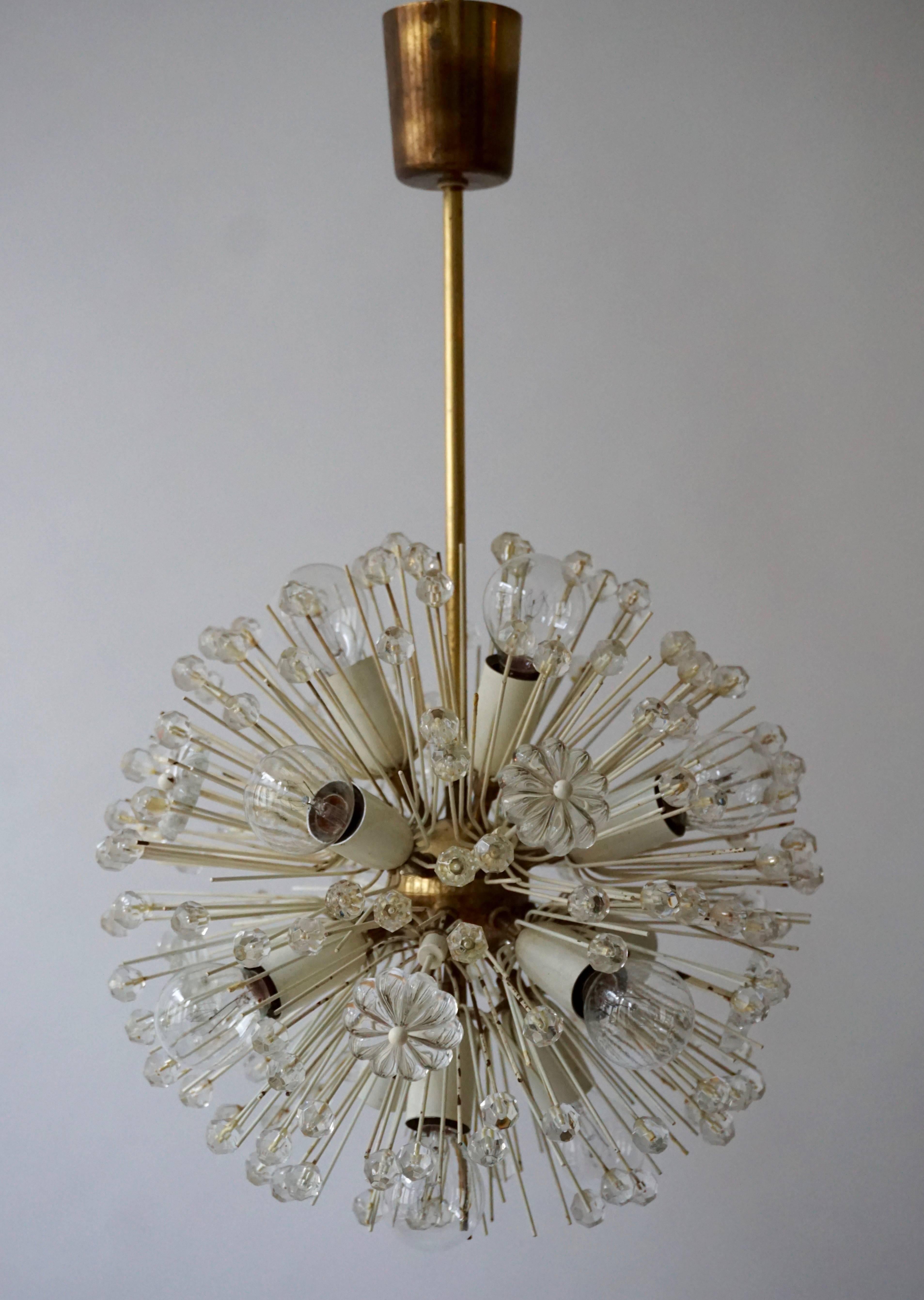 Sputnik thirteen-light brass fixture with copious amounts of Austrian crystals by Emil Stejnar for Nikoll. Cosmological. This glamorous delicate brass ‘Snowball’ Sputnik chandelier is also known as ‘pusteblume’, or ‘snowflake’ and is made in Vienna