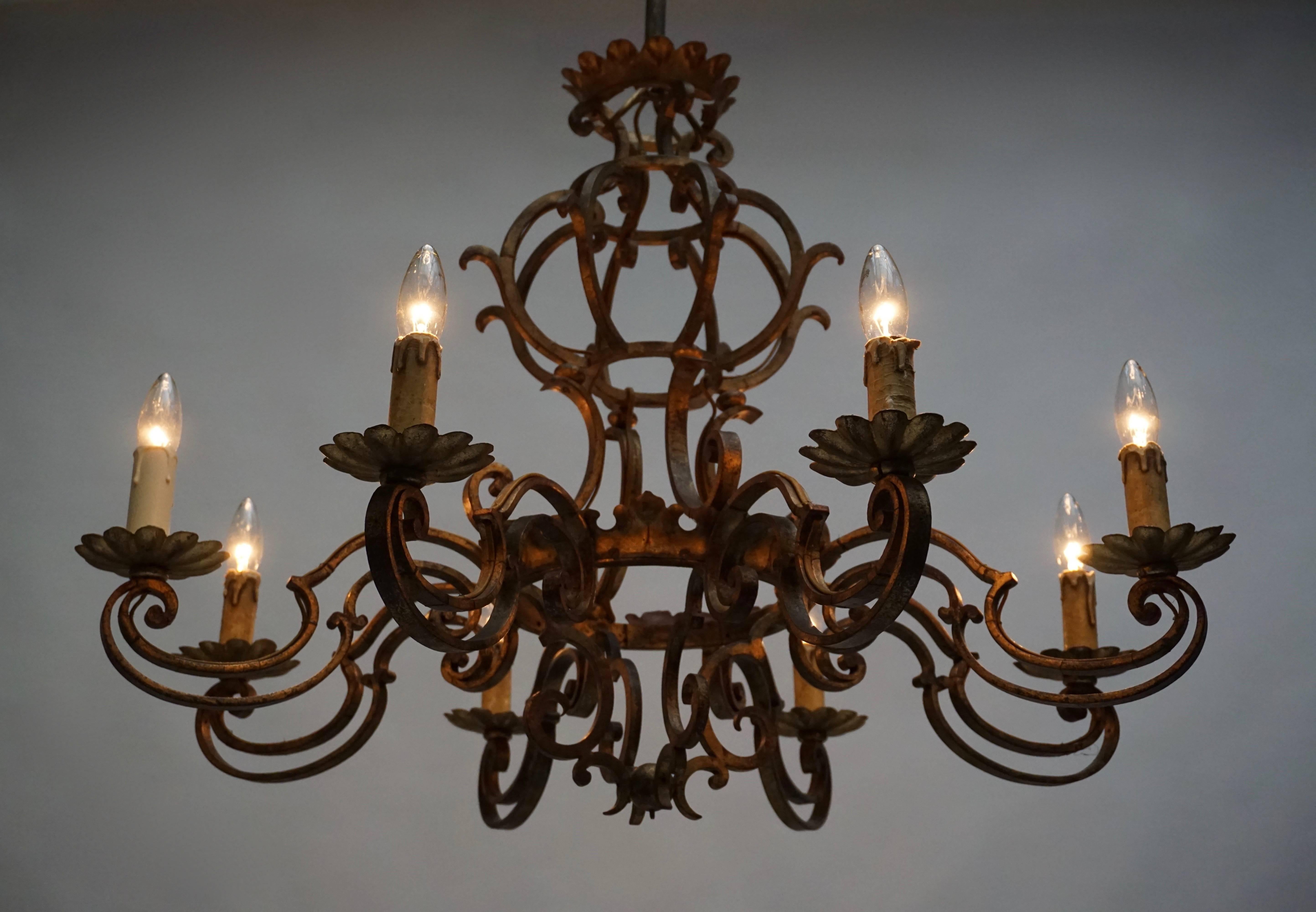 A gilt metal chandelier with eight arms.
Diameter:86 cm.
Height:75 cm.
Eight E14 bulbs.
It is wired for European standard.
