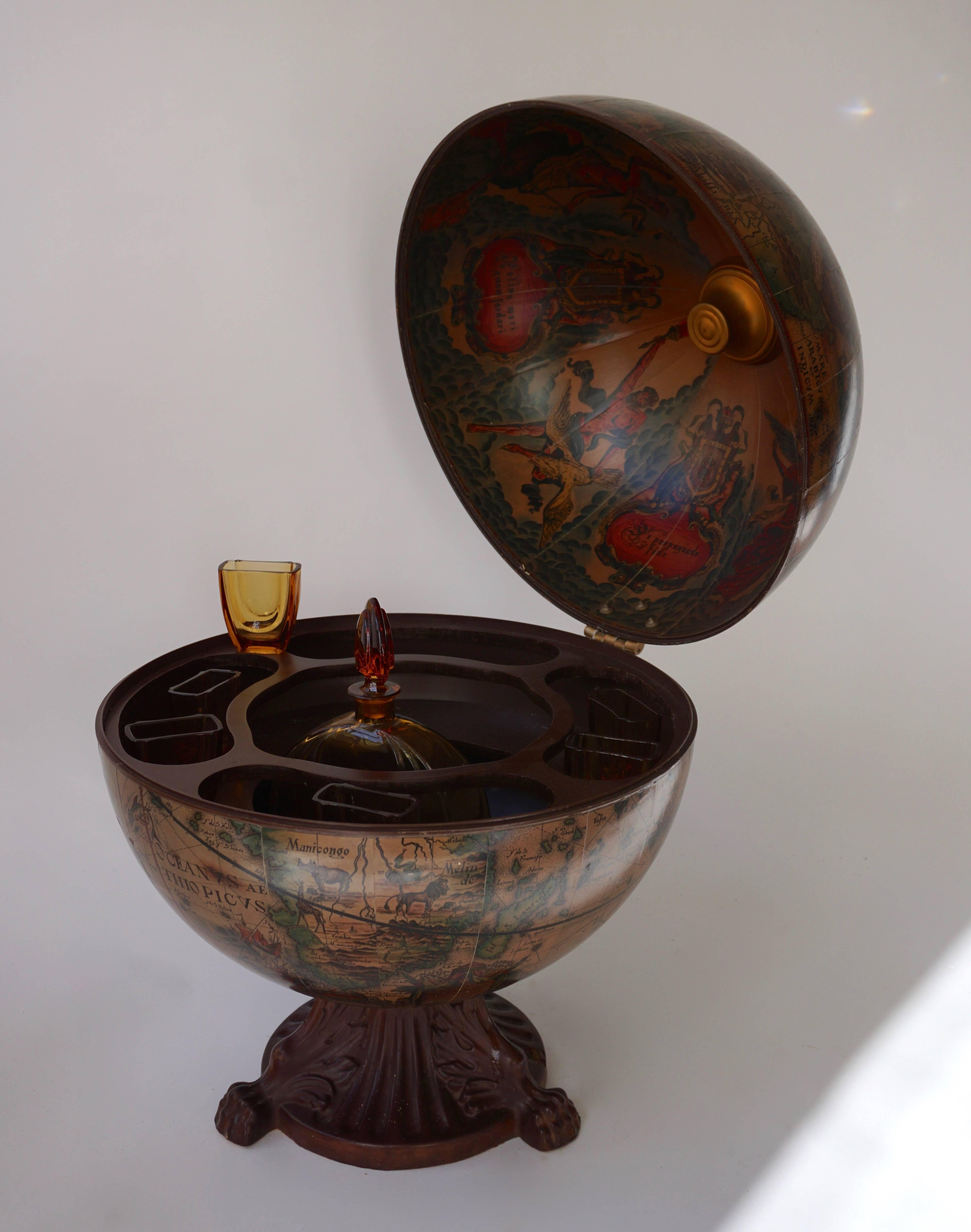 Very elegant Italian Mid-Century Modern globe dry bar. The globe opens to reveal a dry bar inside with plenty of space. Having pictures of Greek mythology and mythical creatures. Adding the perfect decor to any room.
Measures: Height 55