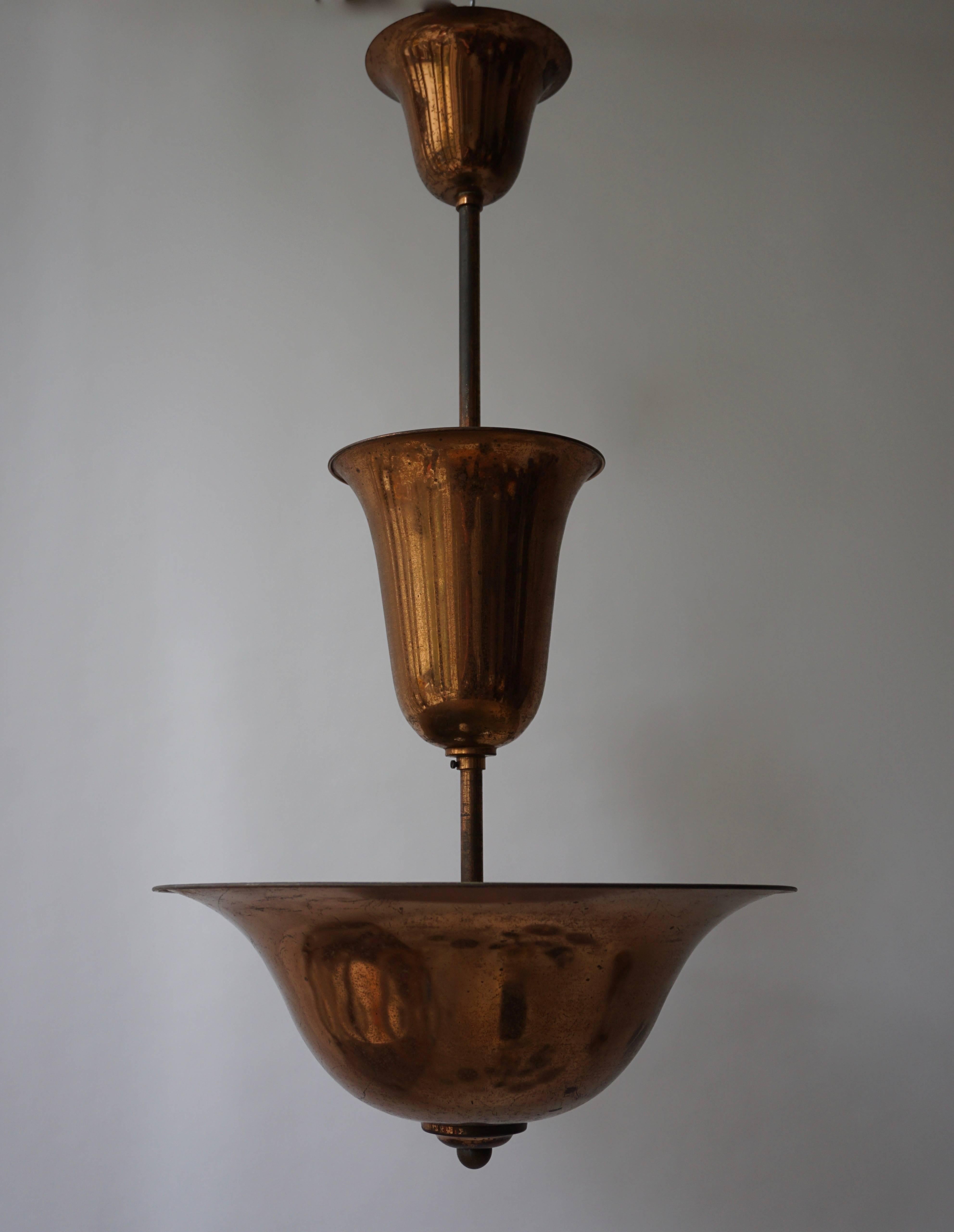 Art Deco copper chandelier.
Measures: Diameter 45 cm.
Height 85 cm.