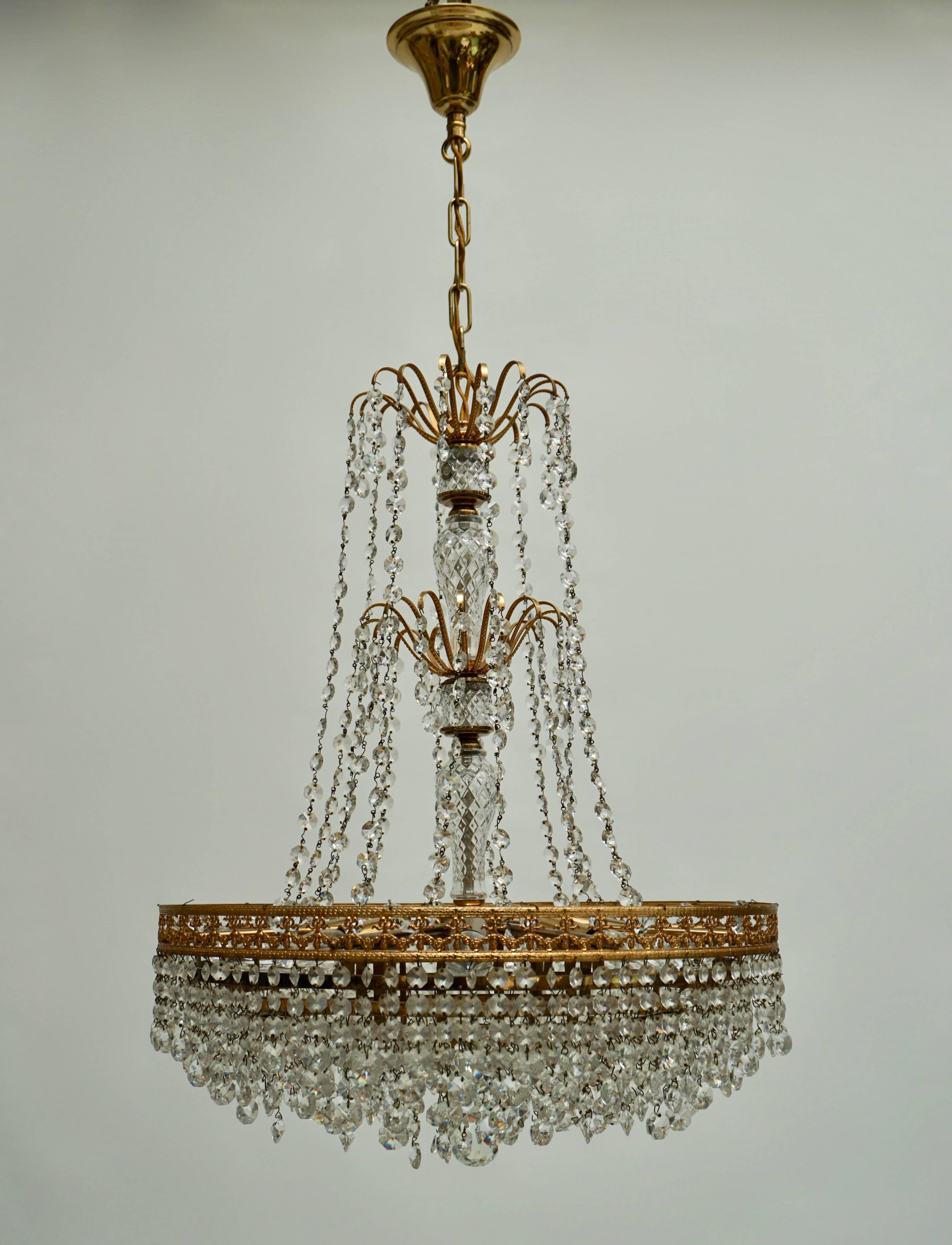 Crystal and brass chandelier, France.
Eight E14 bulbs.
Diameter 50 cm.
Height fixture 65 cm.
Total height 105 cm.