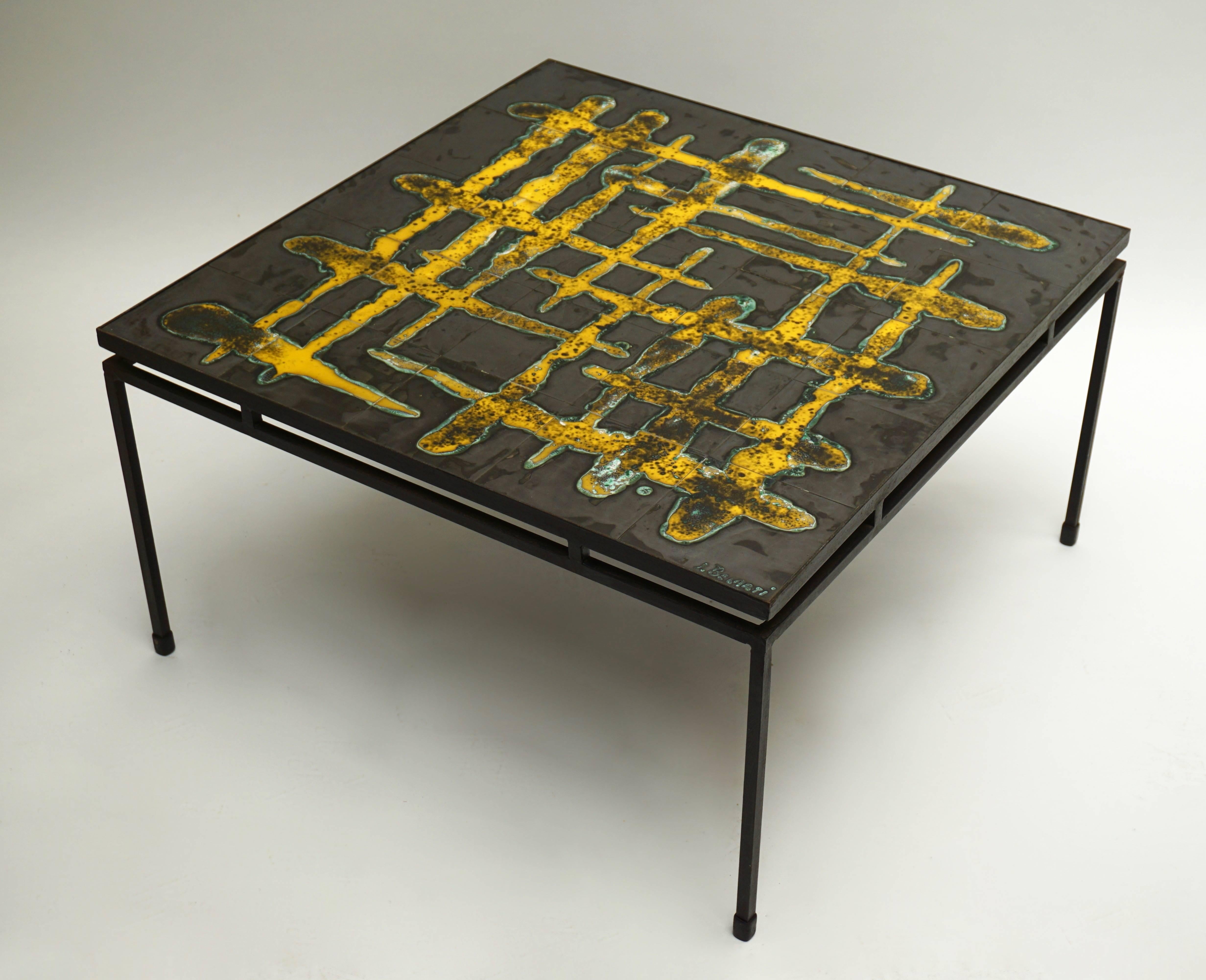 Ceramic abstract 1950s coffee table. Signed Belarti.

The table has a black metal base and the top of the table has ceramic tiles with a beautiful abstract pattern, characteristic of Juliette Belarti's designs.

Measures: 
Height 42 cm.
Width 78