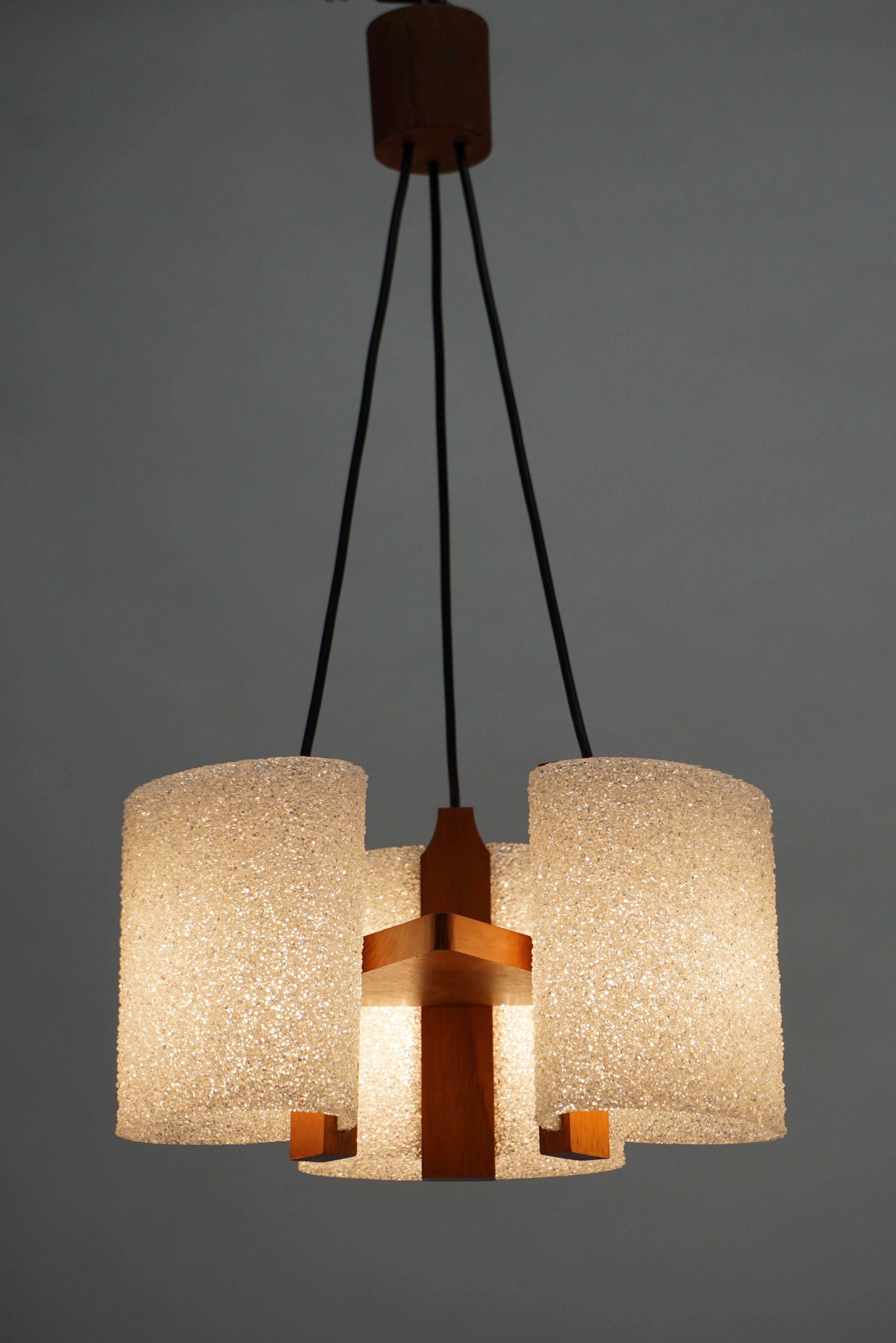 Elegant 1950s chandelier is wood and acrylic.

Diameter:32 cm.
Height 65 cm.