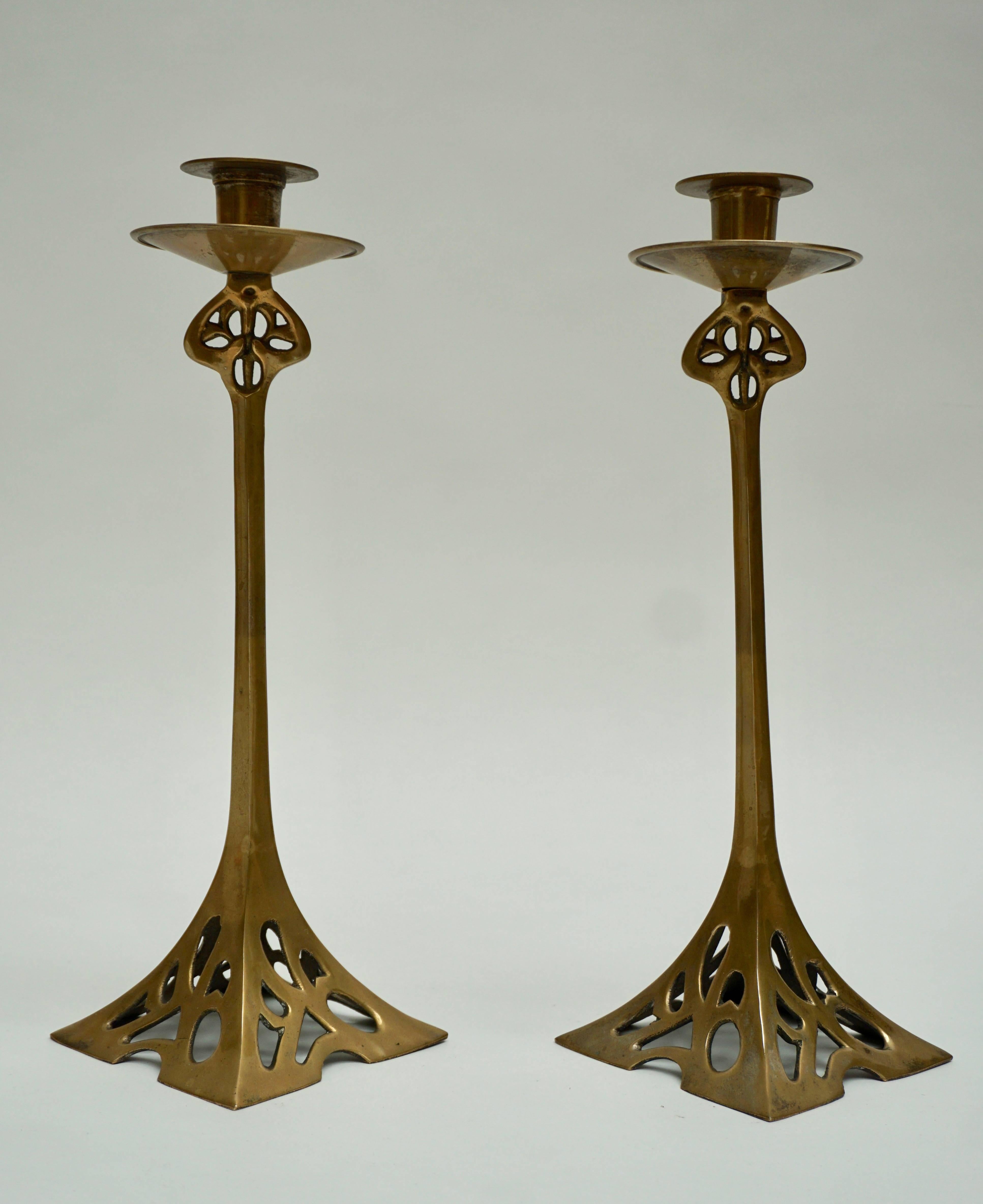 A pair of Art Nouveau brass candlesticks.
Measures: Height 37 cm.