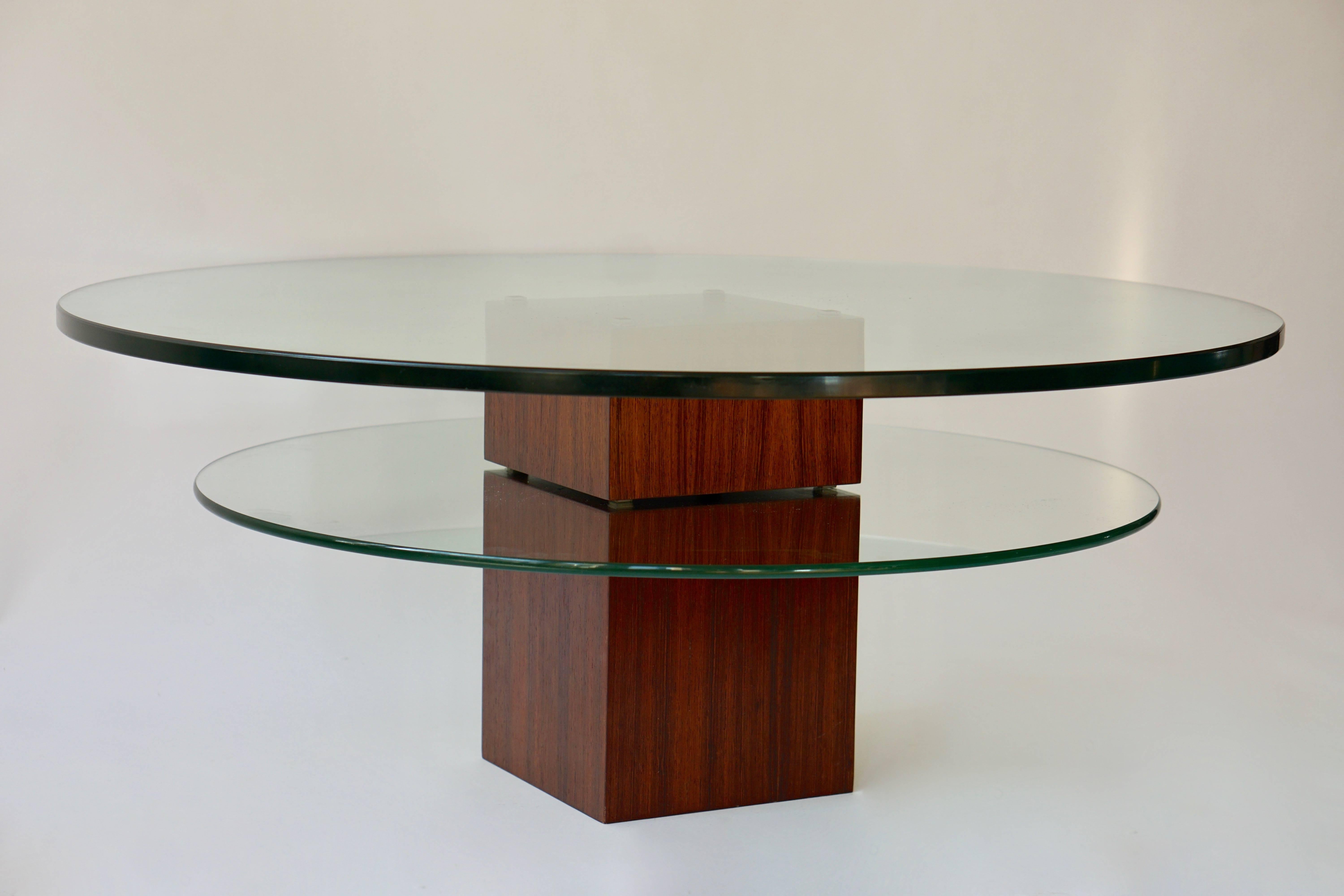 Glass coffee table with wooden base.
Diameter:100 cm.
Height:40 cm.