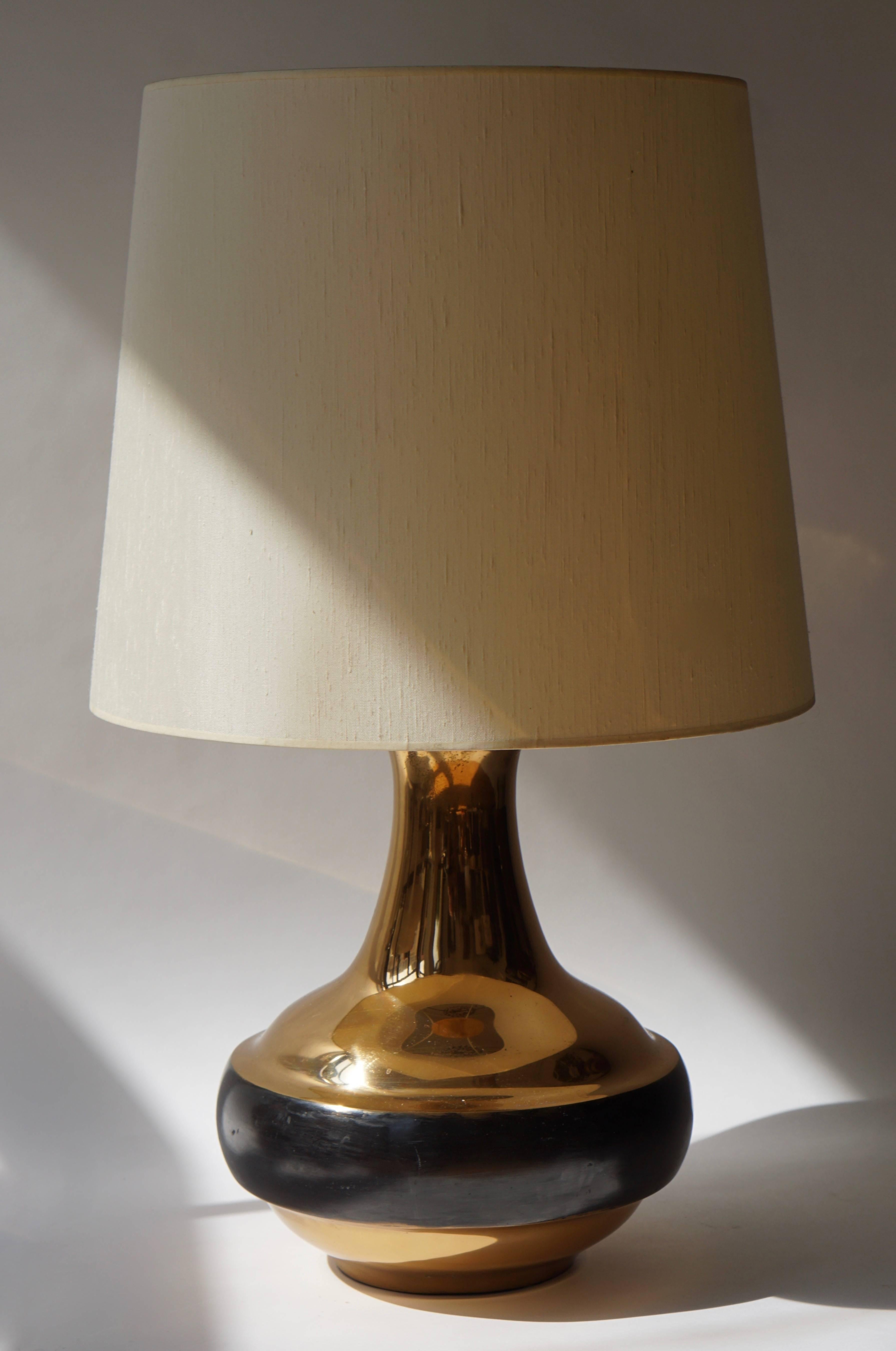 Italian bronze table or floor lamp by Bruno Gambone.

Diameter:83 cm.
Height:50 cm.
Height base:40 cm.
Diameter base:33 cm.
Weight base:12 kg.