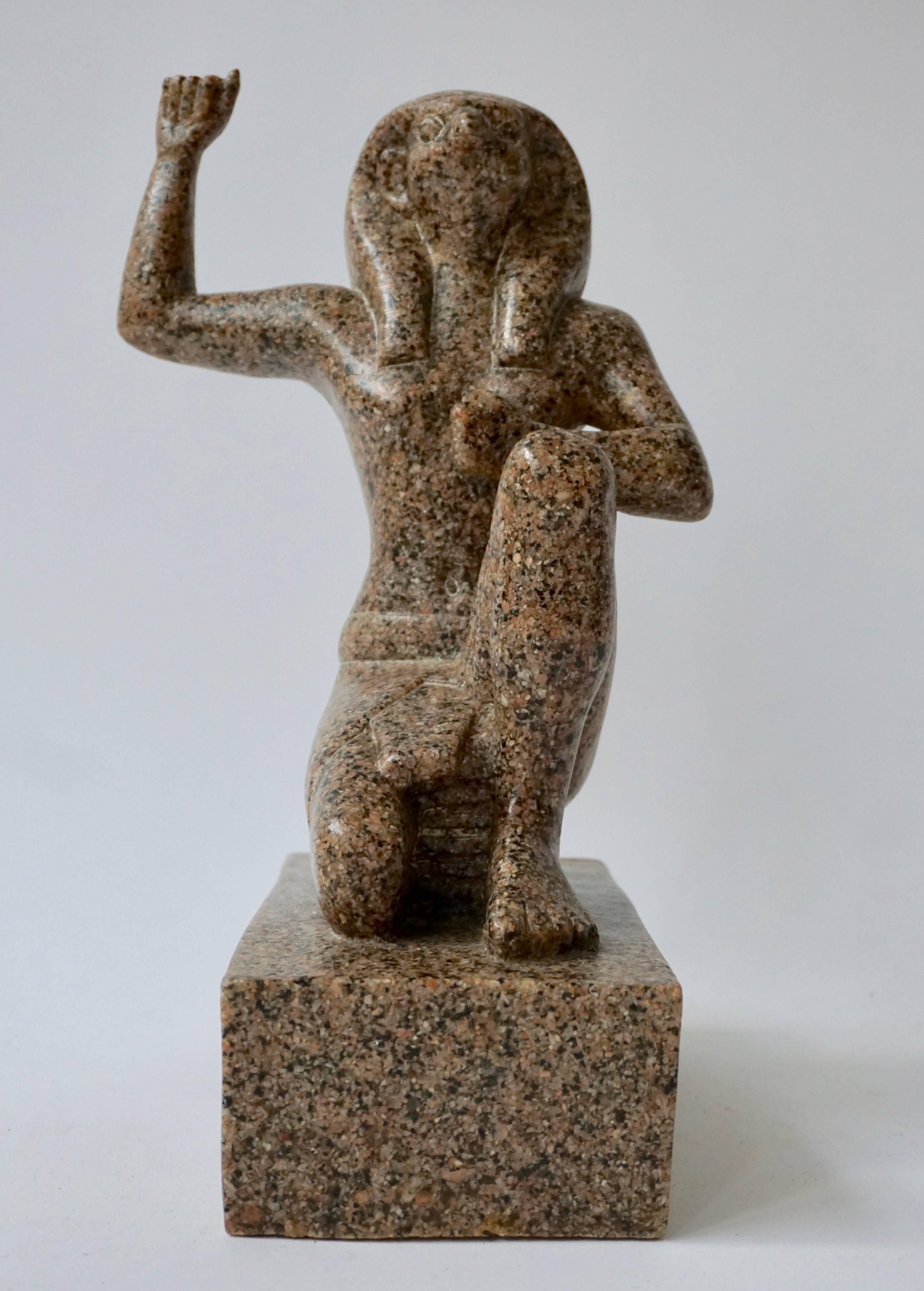 A mixed granite and polyester cast figure of the Egyptian deity Horus, kneeling on one leg with the other sitting upright holding one arm to his heart and the other raised in a fist.



Measures: Height 33 cm.
Width 12 cm.
Depth 24 cm.
Weight 6 kg.