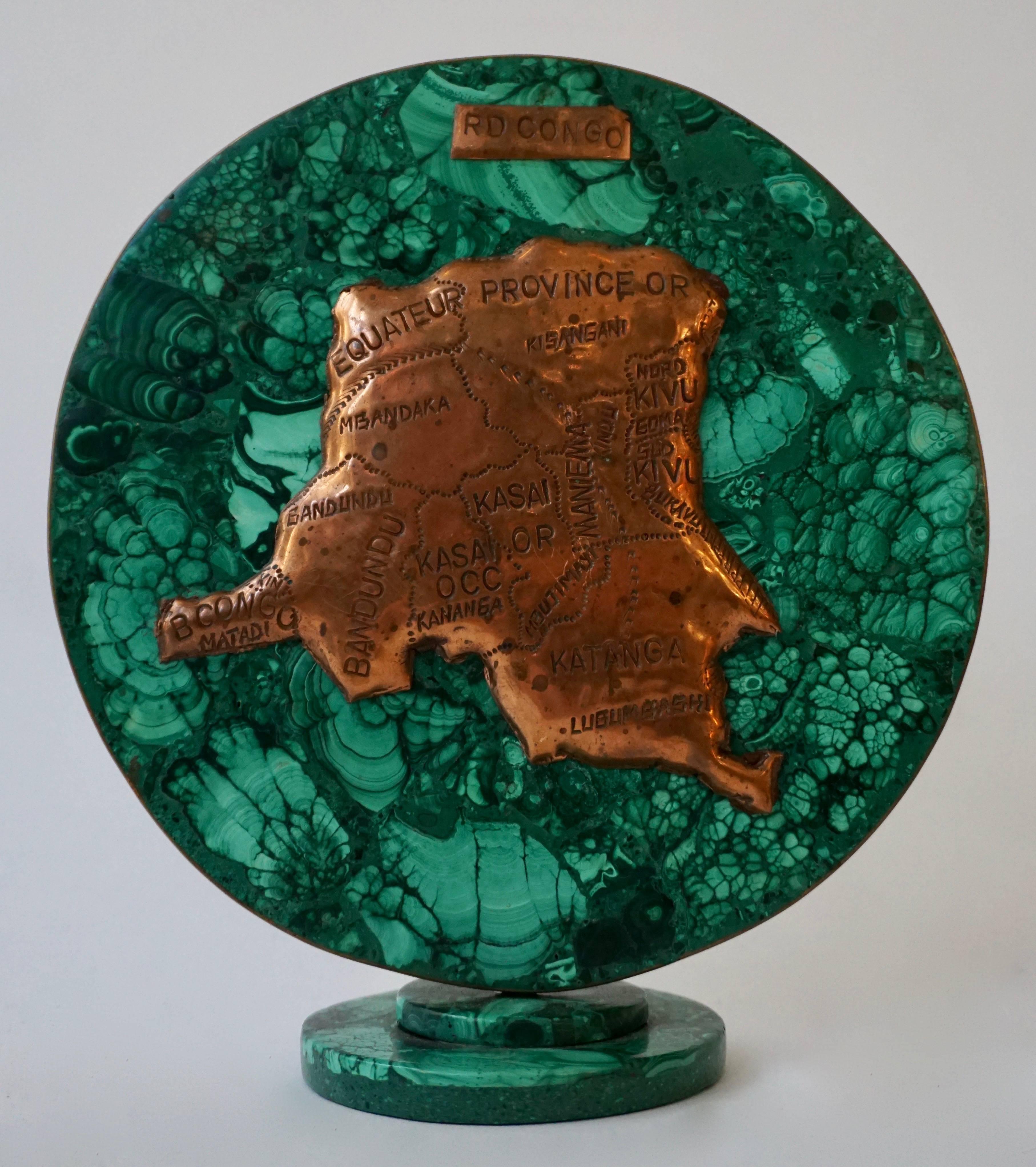 Malachite sculpture with the map of Congo.
Diameter:19 cm.
Height:21 cm.
Depth:8 cm.