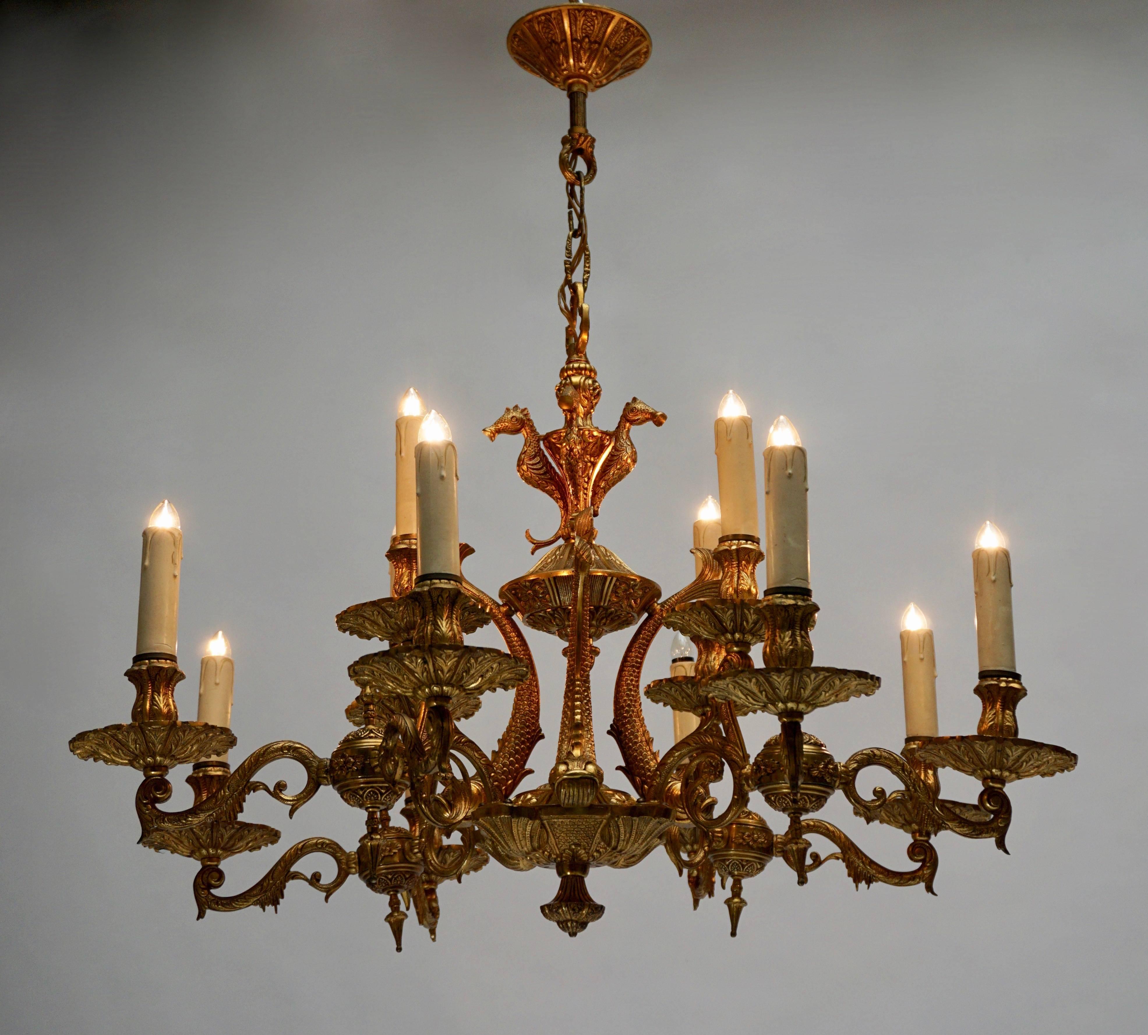 A beautiful and elegant bronze chandelier with some fishes in the centre.
Measure: Diameter 80 cm.
Height fixture 57 cm.
Total height with the chain 80 cm.
Twelve E14 bulbs.
 