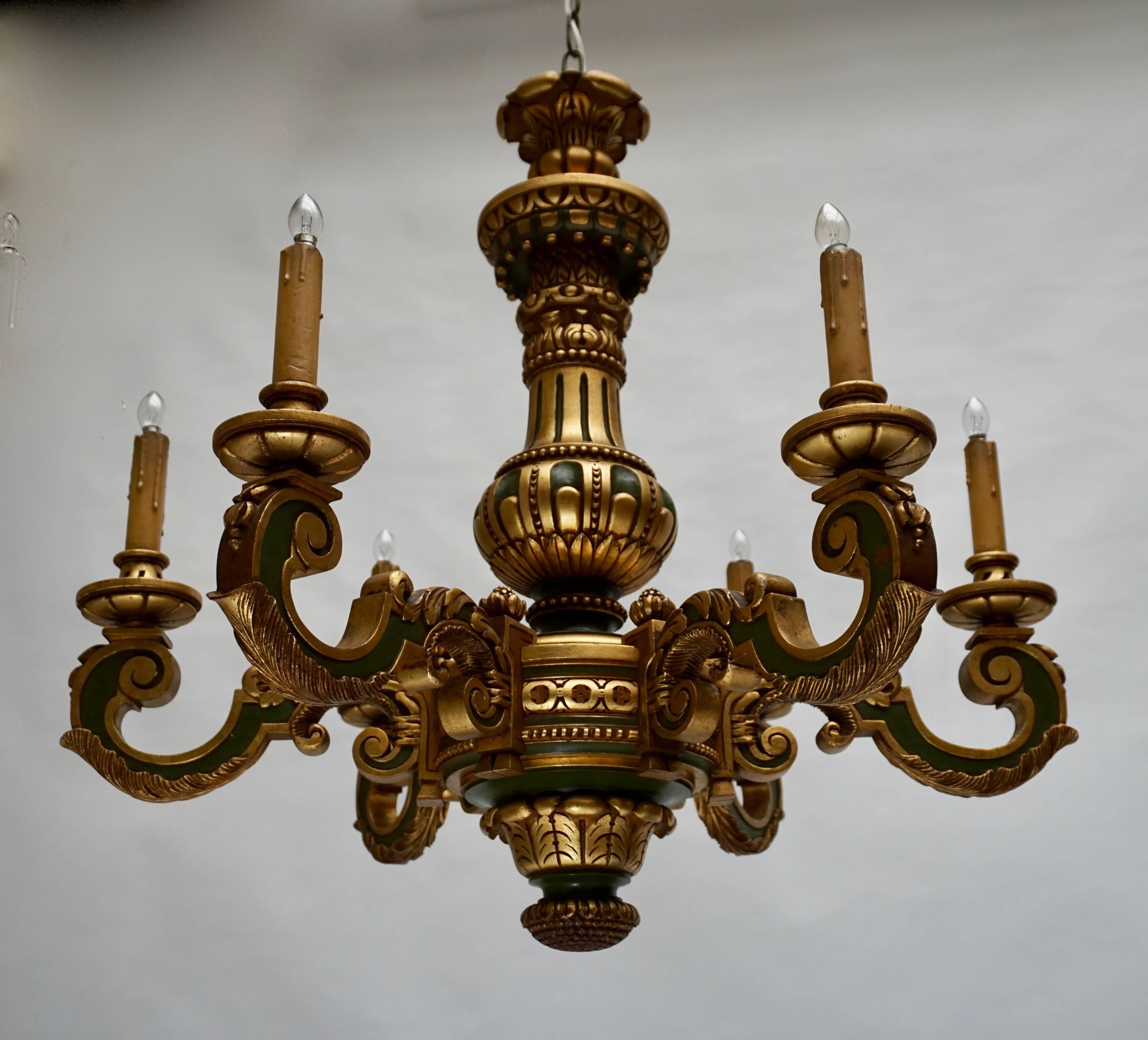 Italian painted and giltwood chandelier.
Diameter;77 cm.
Height fixture;72 cm.
Total height with chain;120 cm.
