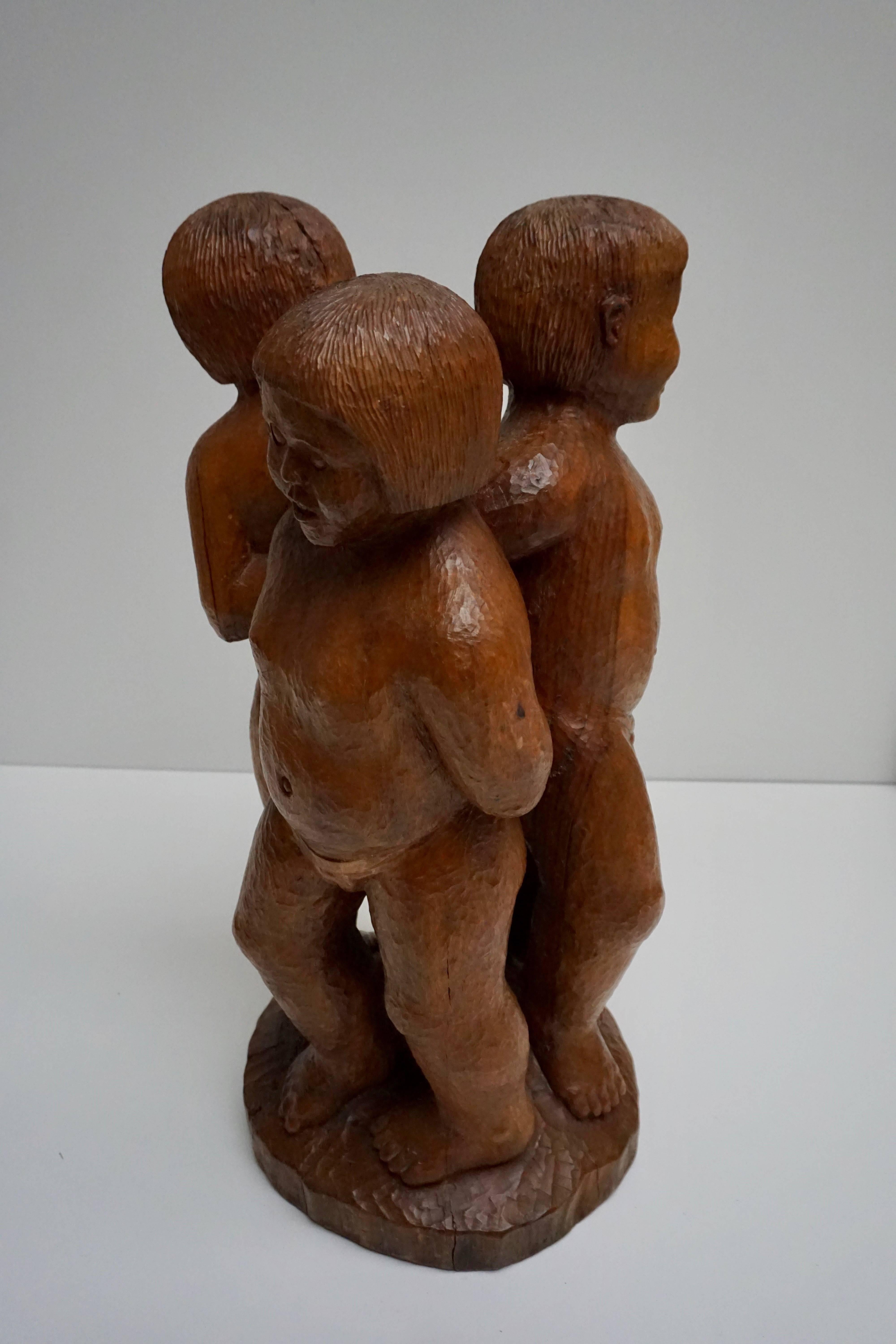 Wooden sculpture of three naked children, signed A Dendooven 1990, Belgium.
Measures: Height 66 cm.
Diameter 32 cm.
Weight 12 kg.