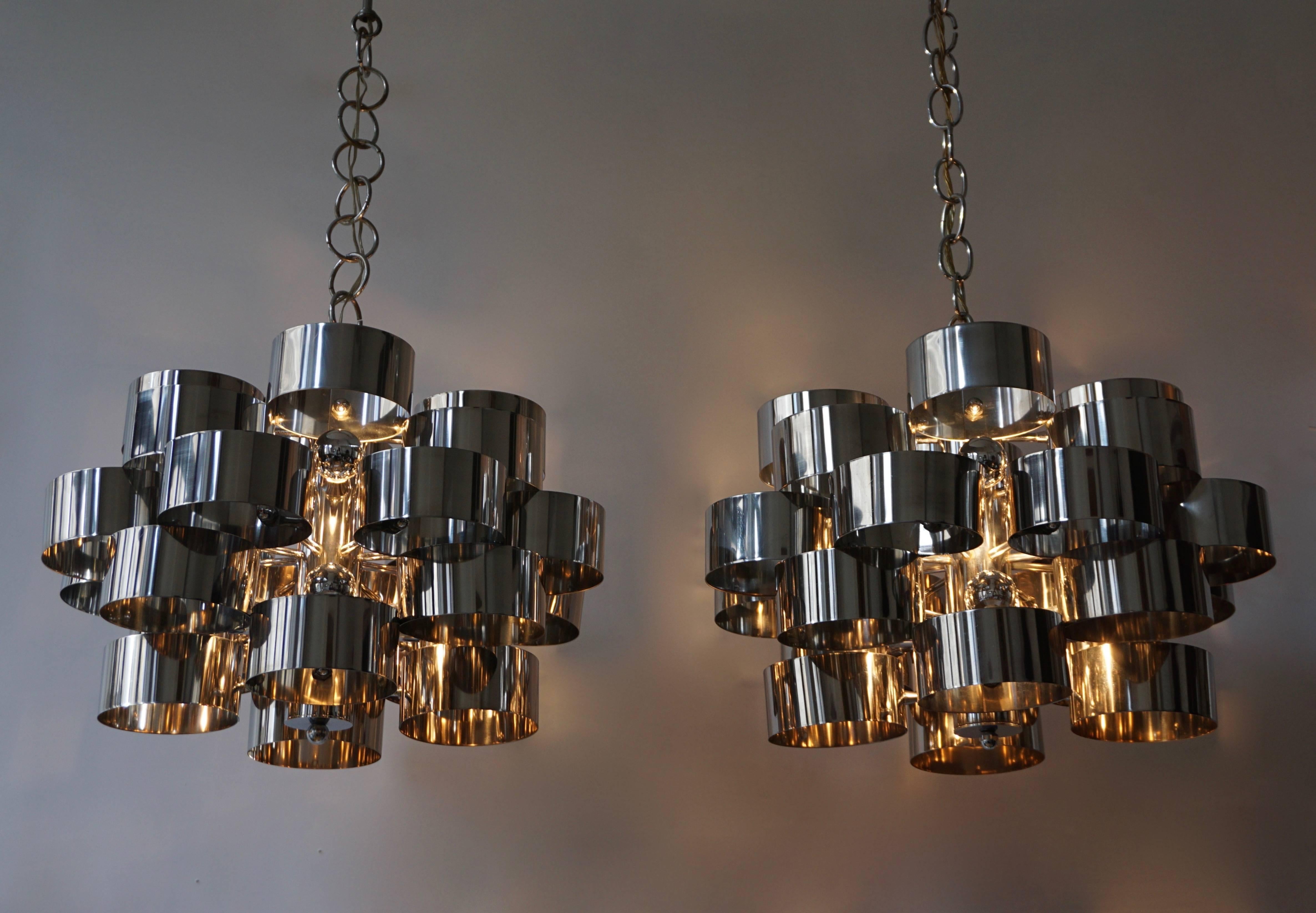 One of two  of 1970s chrome band loop chandeliers by Gaetano Sciolari.

Diameter 50 cm.
Height fixture 31 cm.

Please note that price is per item not for the set.
