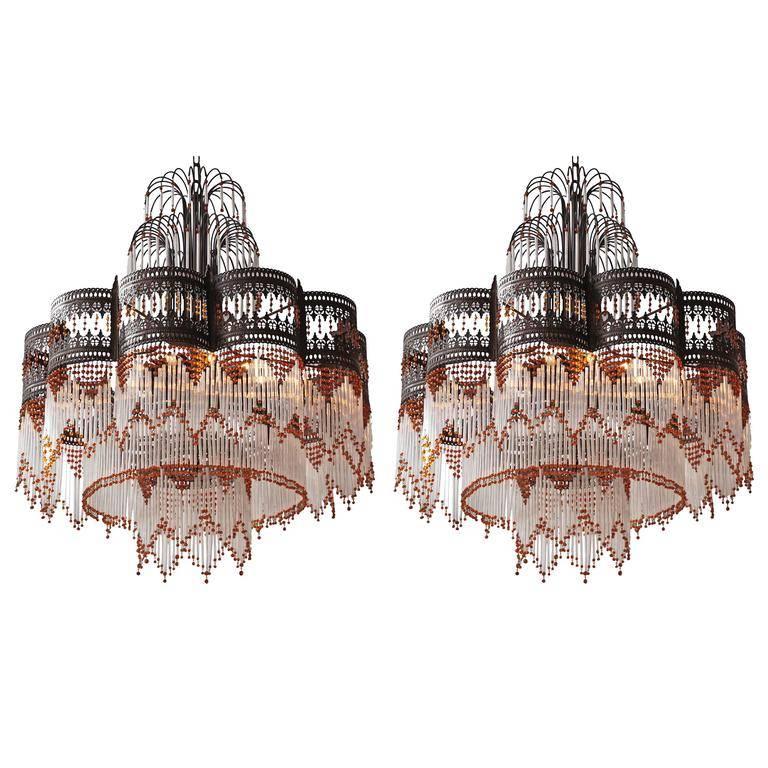 A pair of huge Italian chandeliers with Murano glass.
Total height with chain is 130 cm.
Ten E14 bulbs.