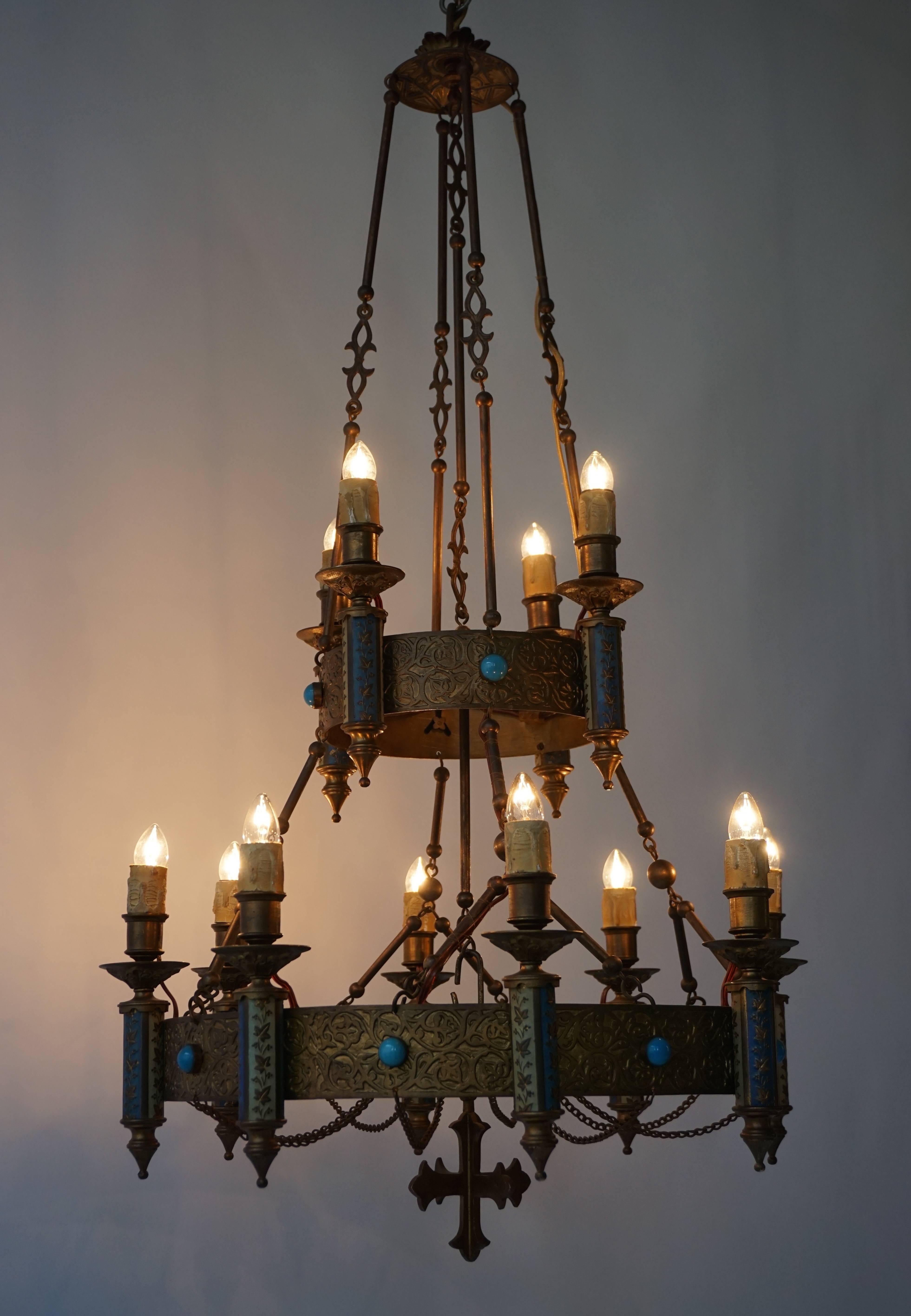 Beautiful neo-Gothic church chandelier in brass and copper with enamel and glass decorations.
Measures: Diameter 50 cm.
Height 85 cm.
Total height 200 cm.