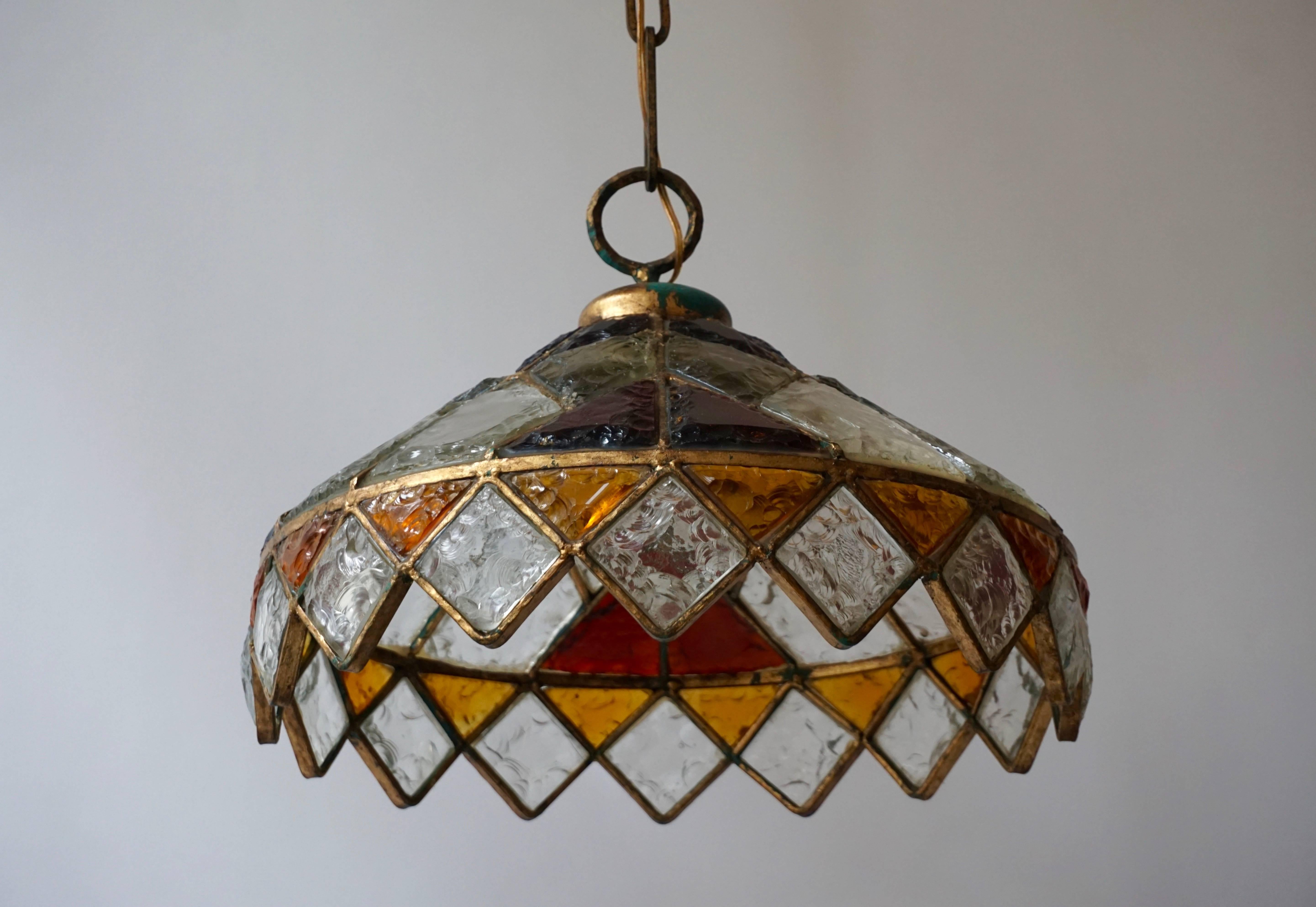 Rare colored stained glass chandelier. 

Measure: 
Total height with the chain is 125 cm.
The diameter is 52 cm.
The weight is 14 kg.