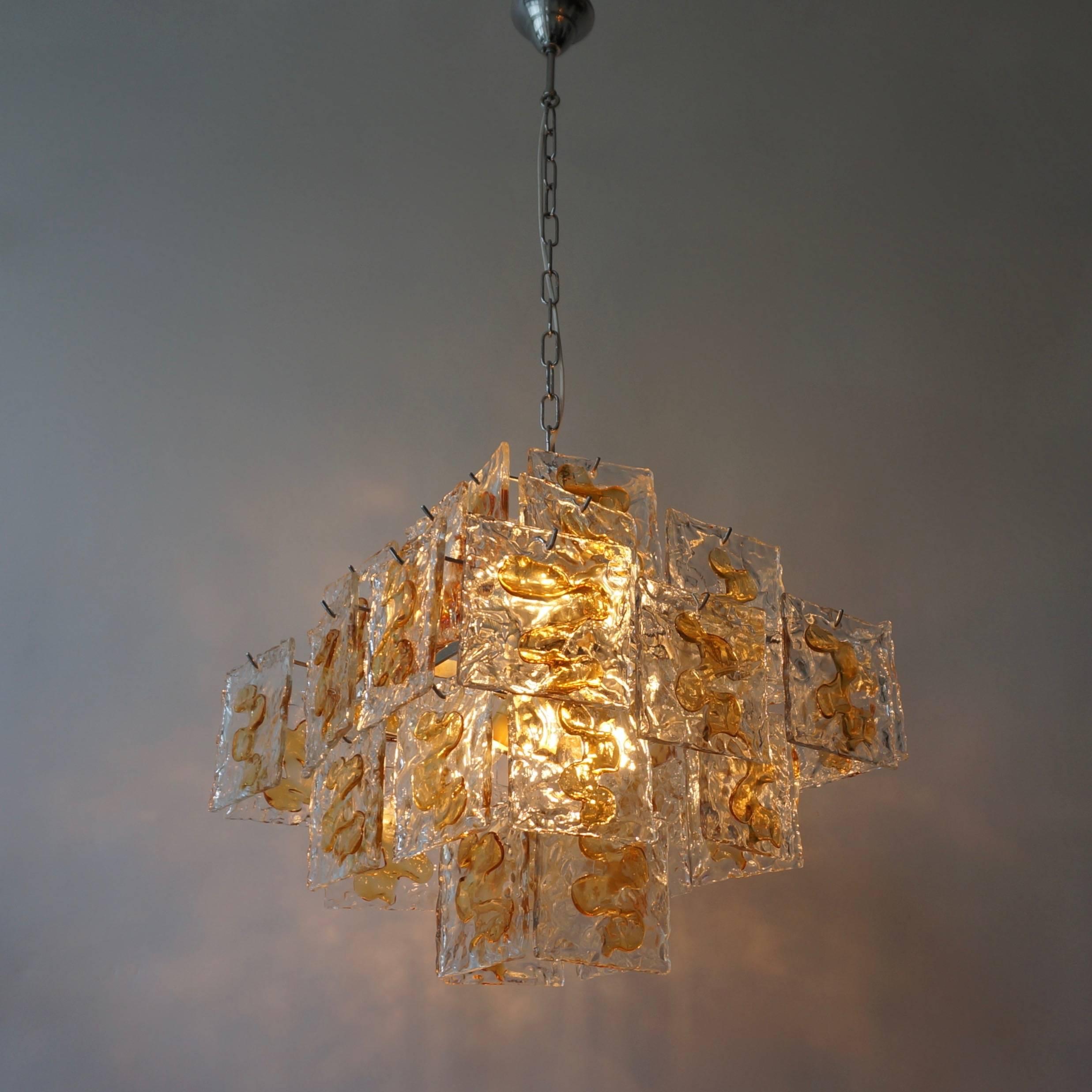 Italian Murano glass chandelier by Mazzega. 

The light requires eight single E14 screw fit lightbulbs (40Watt max.) LED compatible.
Total height with the chain is 110 cm.