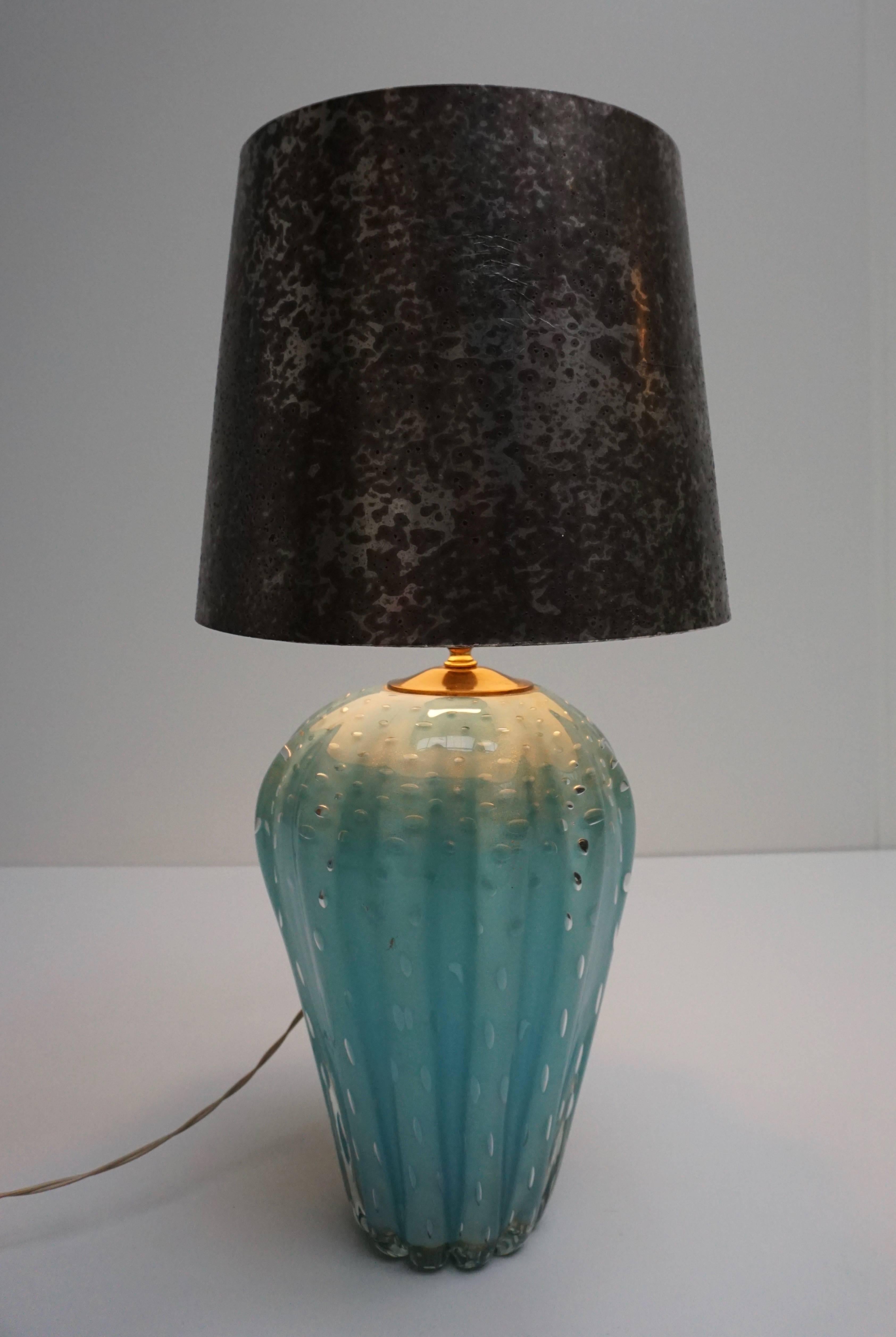 Italian Murano glass table lamp.
The lampshade is not included in the price.
Diameter glass base is 22 cm.
Diameter shade is 30 cm.
Height glass base is 32 cm.
Height glass base with fitting is 40 cm.
Total height with the shade is 61 cm.
