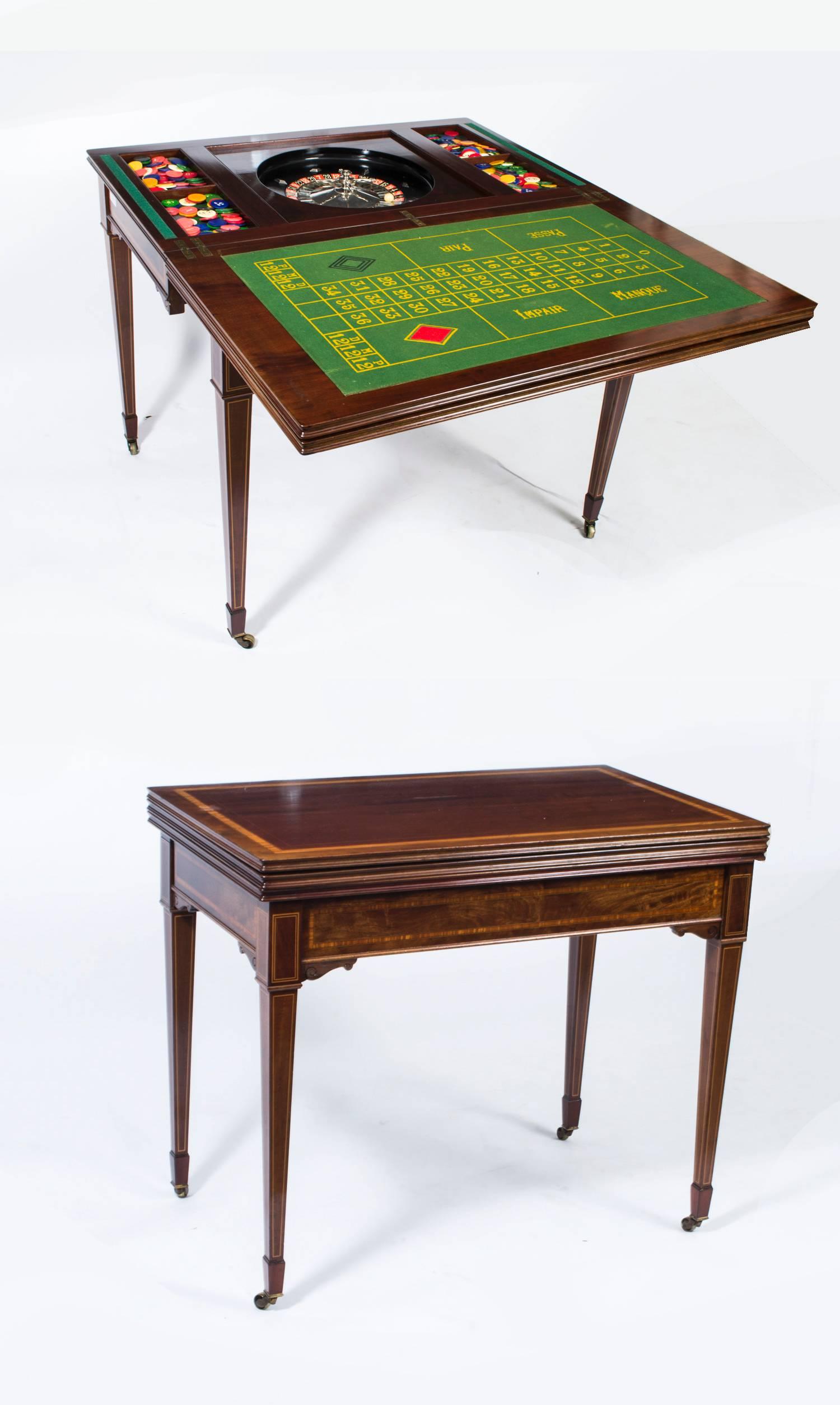 This is a fabulous high quality antique Edwardian mahogany, satinwood crossbanded and line inlaid triple top games table for cards and roulette, circa 1900 in date.

The hinged triple top opens to reveal a fabulous gaming interior for playing