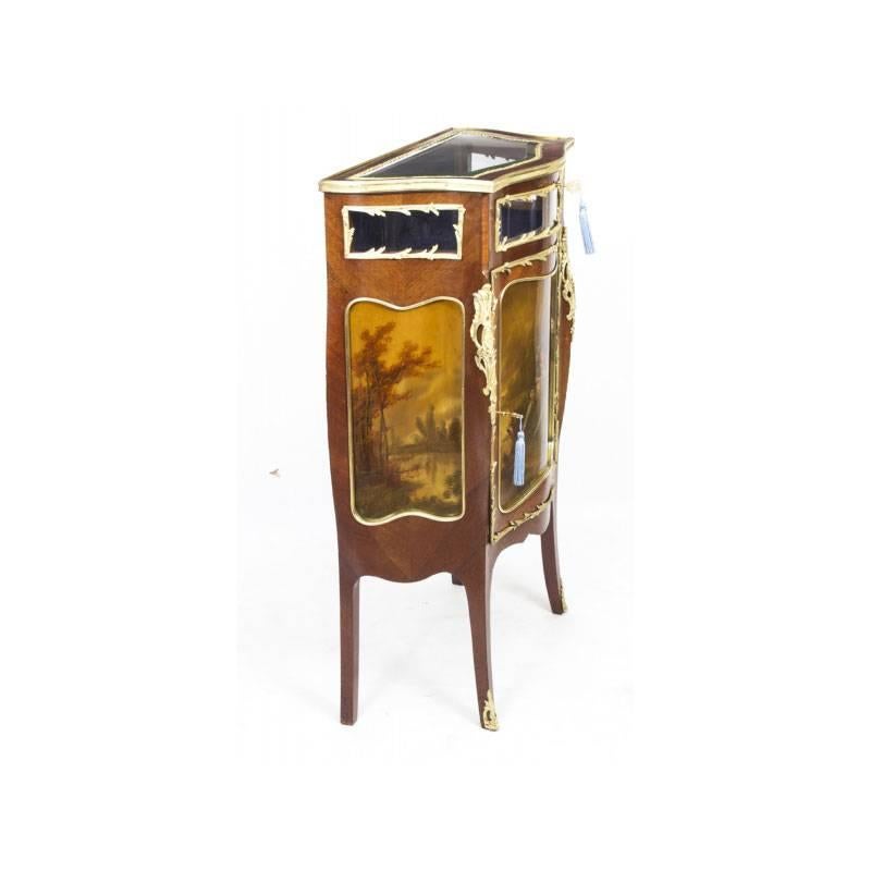 This is a stunning antique French mahogany and goncalo alves Vernis Martin painted and ormolu-mounted serpentine fronted bijouterie side cabinet, circa 1880 in date.

The hinged and glazed bijouterie top is perfect for displaying your collectables