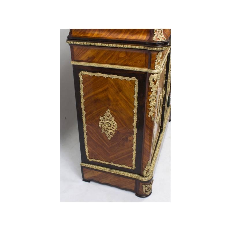 A beautiful 19th century French  side cabinet, circa 1860 in date.

This stunning antique French side cabinet is a true rarity. 
Adding to its truly unique character it has been decorated with a plethora of exquisite gilded ormolu mounts and is