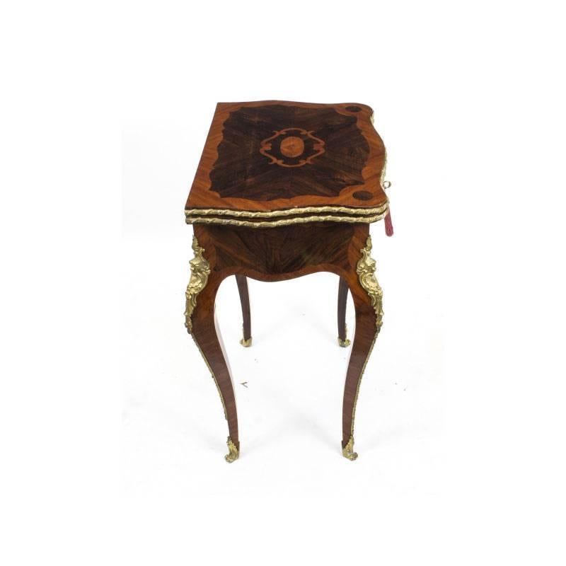 This is a magnificent antique French rosewood and kingwood ormolu-mounted card table, circa 1870 in date.

The swivel top opens to reveal a beautiful green baize lined interior, which is perfect for playing cards and it has a useful drawer for