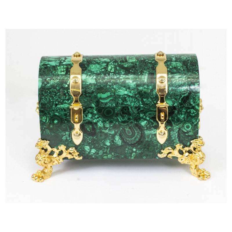 This is a superb quality domed malachite casket dating from the second half of the 20th century.

Decorated with fabulous gilt bronze ormolu mounts comprising stunning strapwork, lion's head drop handles on the sides and raised on decorative claw