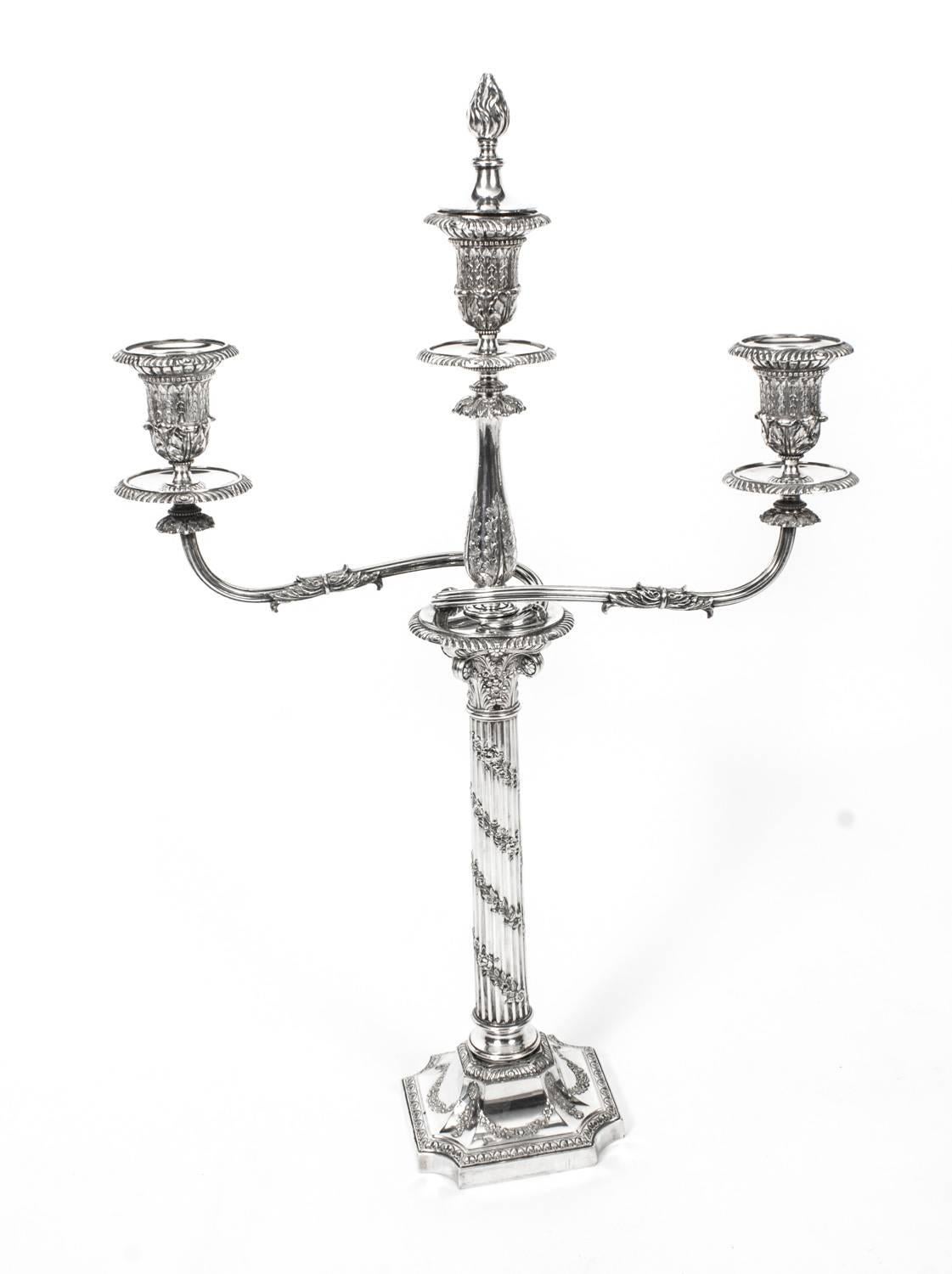 This is a superb pair of antique Victorian silver plated, three light, two-branch table Corinthian column candelabra, circa 1880 in date, and bearing the makers mark of the renowned silversmiths Horace Woodward & Co. of Birmingham England.
 
The