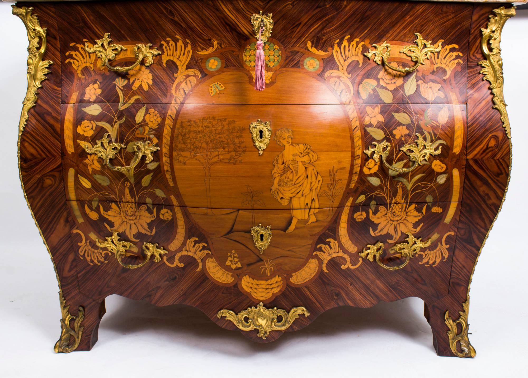 This is a beautiful antique French Goncalo Alves, satinwood and tulipwood marquetry inlaid commode, circa 1830 in date. 

This gorgeous commode has three capacious drawers for ample storage, and was inspired by the Louis XV Revival. Elaborately
