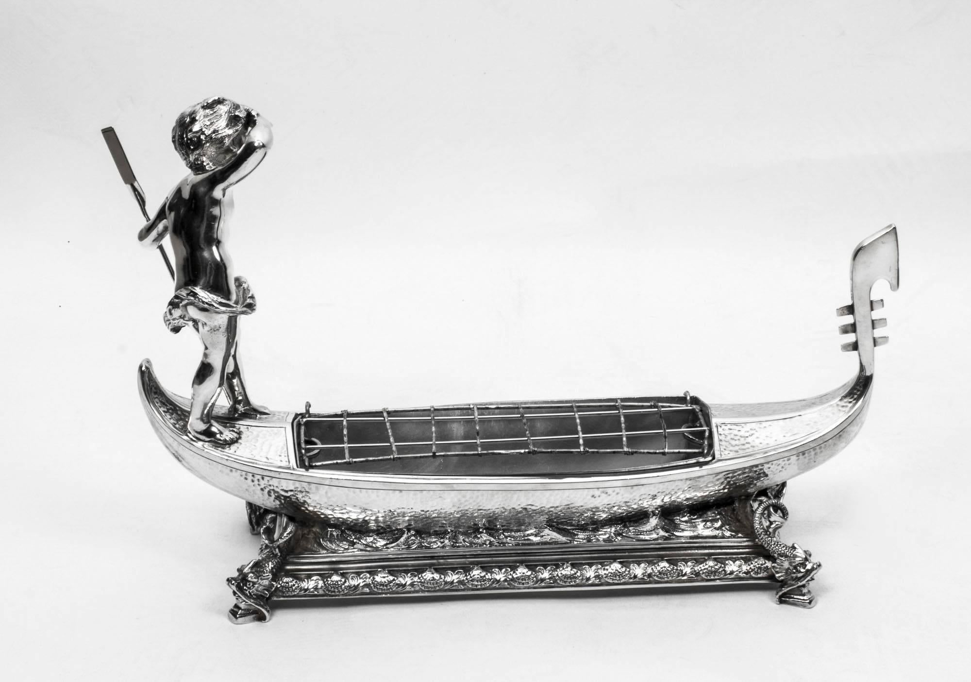 This is an exquisite antique silver-plated Victorian centrepiece in the form of a gondola with a removable jardiniere. The underside bears the impressed mark of the silversmith that made it, William Maples & Sons, circa 1890 in date.

There is