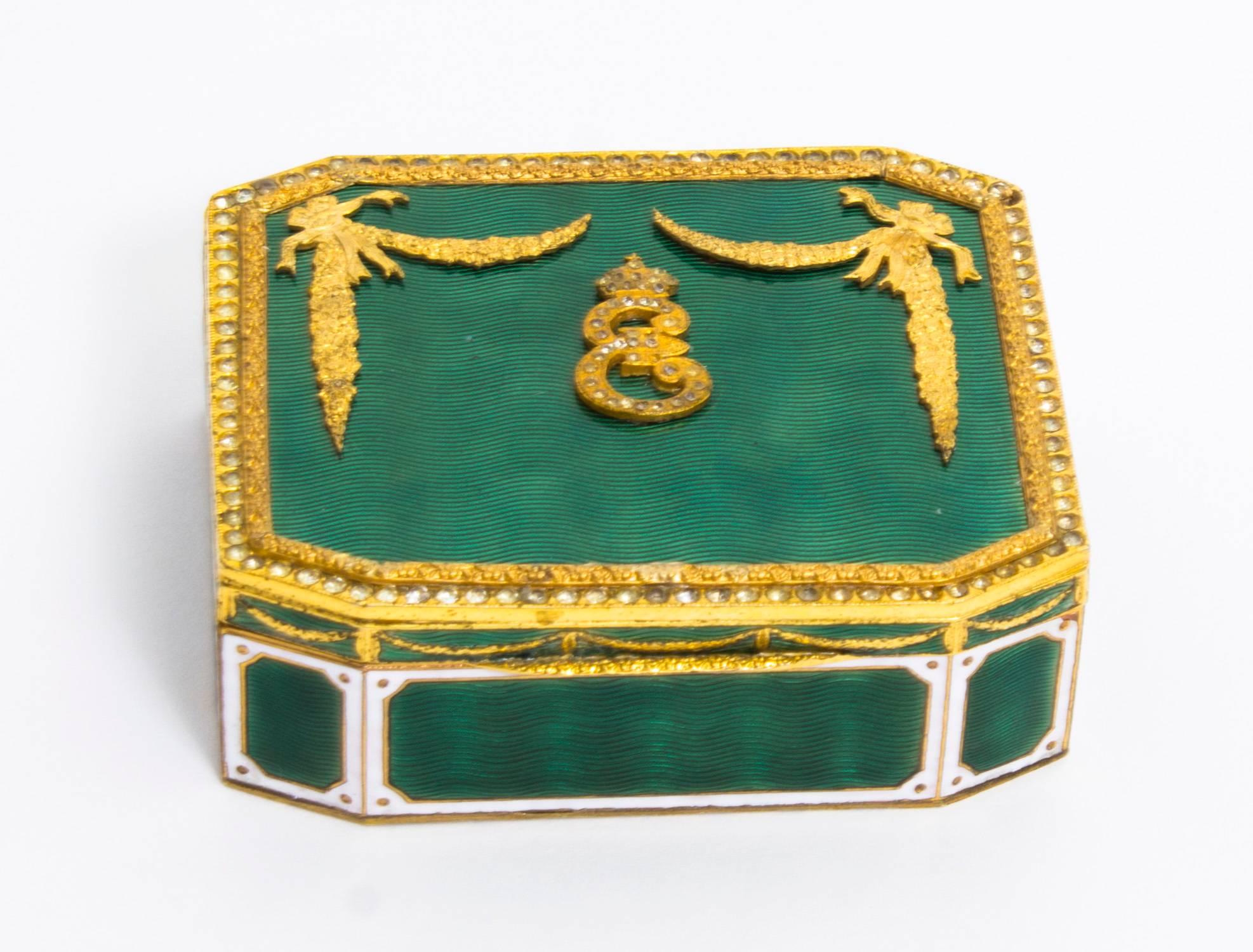 This is a lovely antique Napoleon III gilt ormolu and green and white enamel rectangular trinket box, late 18th Century in date. 

The lid bears a superb Royal Monogramme, the letter E topped with a crown framed by two foliate ribbon corners. The