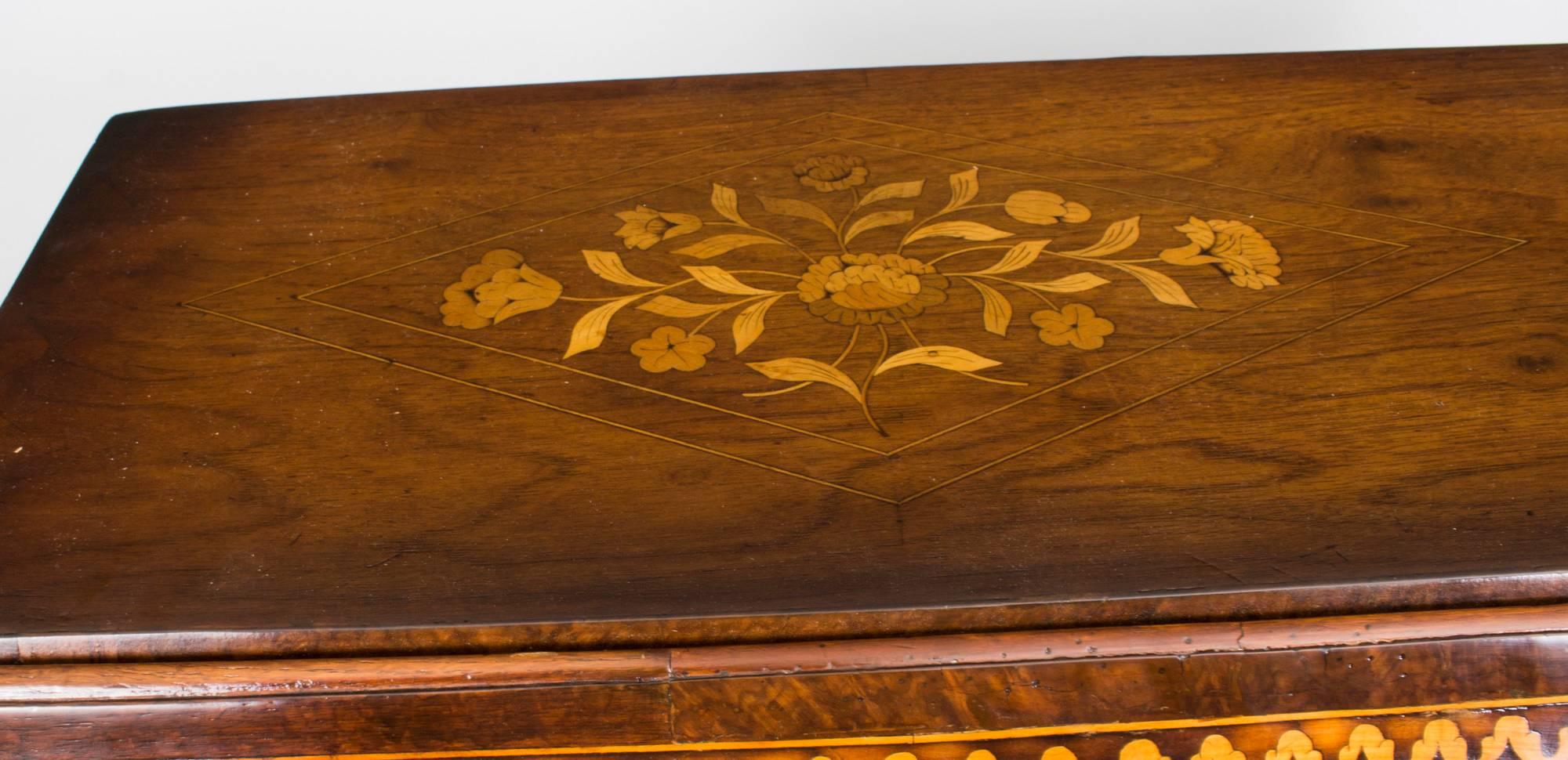 This is a wonderful antique late 18th century Dutch burr walnut and marquetry bombe' bureau.

It has been accomplished in burr walnut, with exquisite hand cut floral marquetry typical of the very best pieces of period Dutch furniture.

The