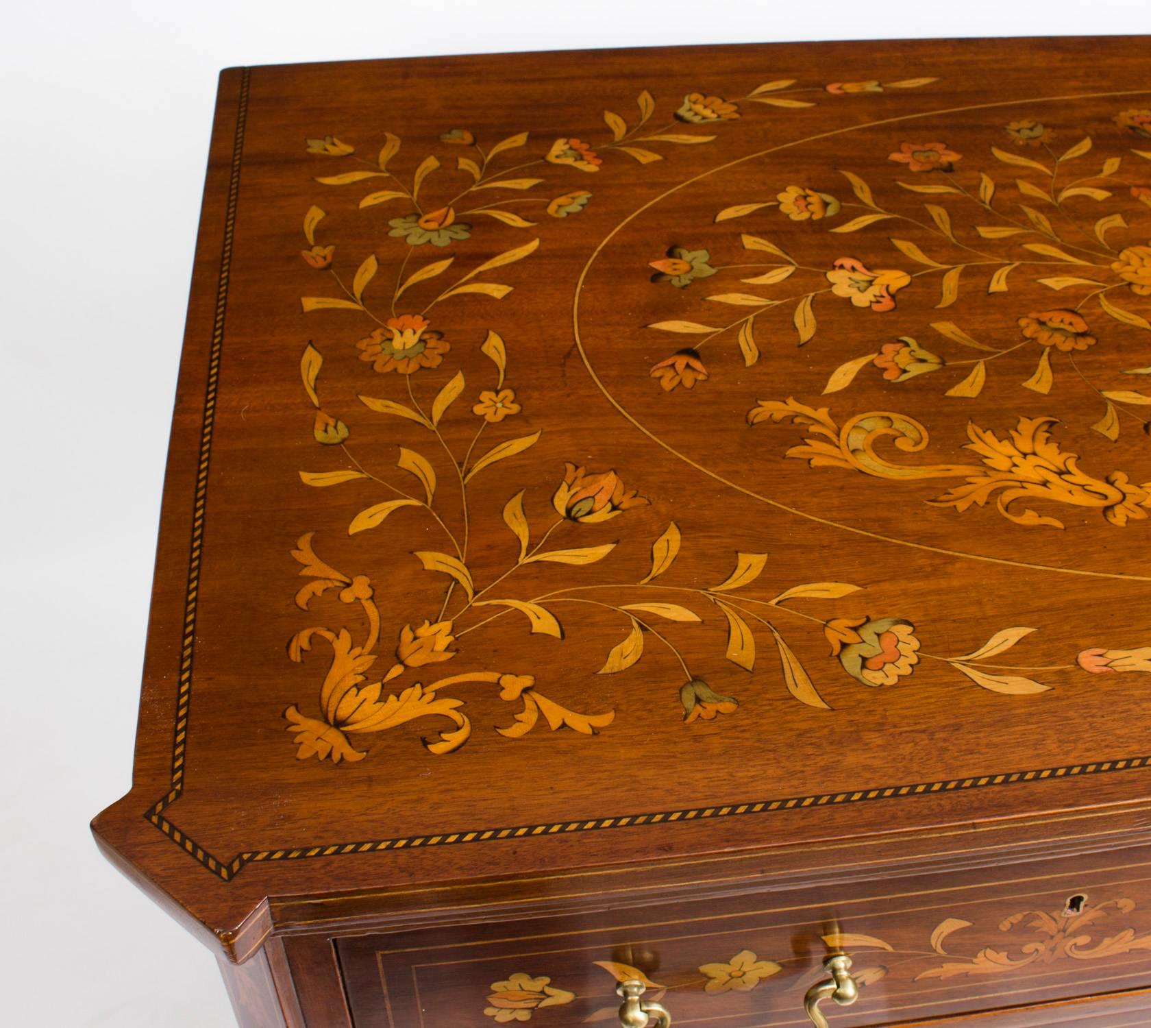 This is a stunning antique Dutch marquetry chest of drawers, circa 1900 in date.

It has been accomplished in mahogany with a plethora of exquisite hand-cut floral marquetry patterns. The rectangular top and the sides all feature fabulous floral