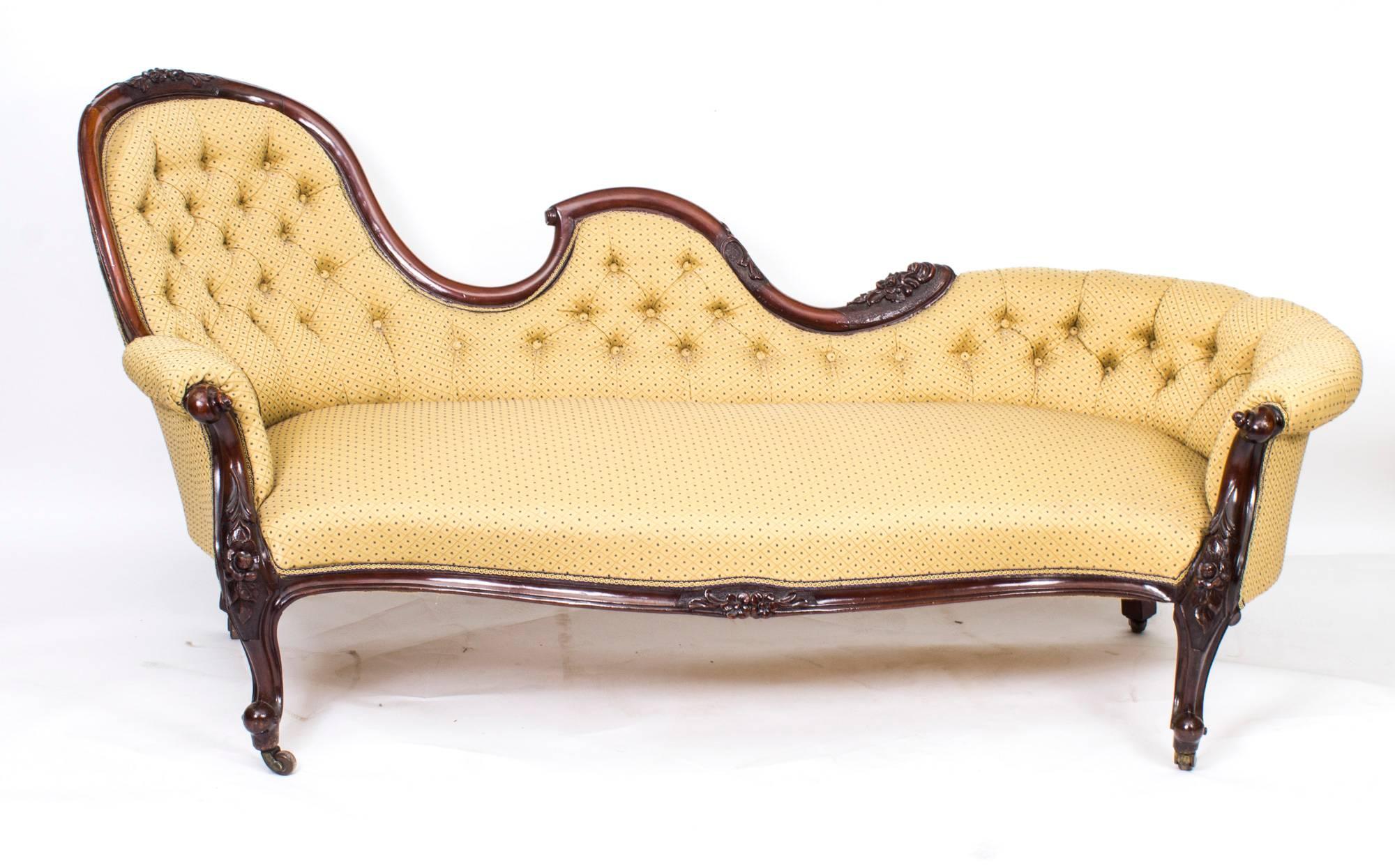 This is a fantastic English antique Victorian chaise longue which dates from circa 1860.

This sofa was made from hand-carved solid walnut and stands on elegant carved cabriole legs which terminate in their original brass and porcelain