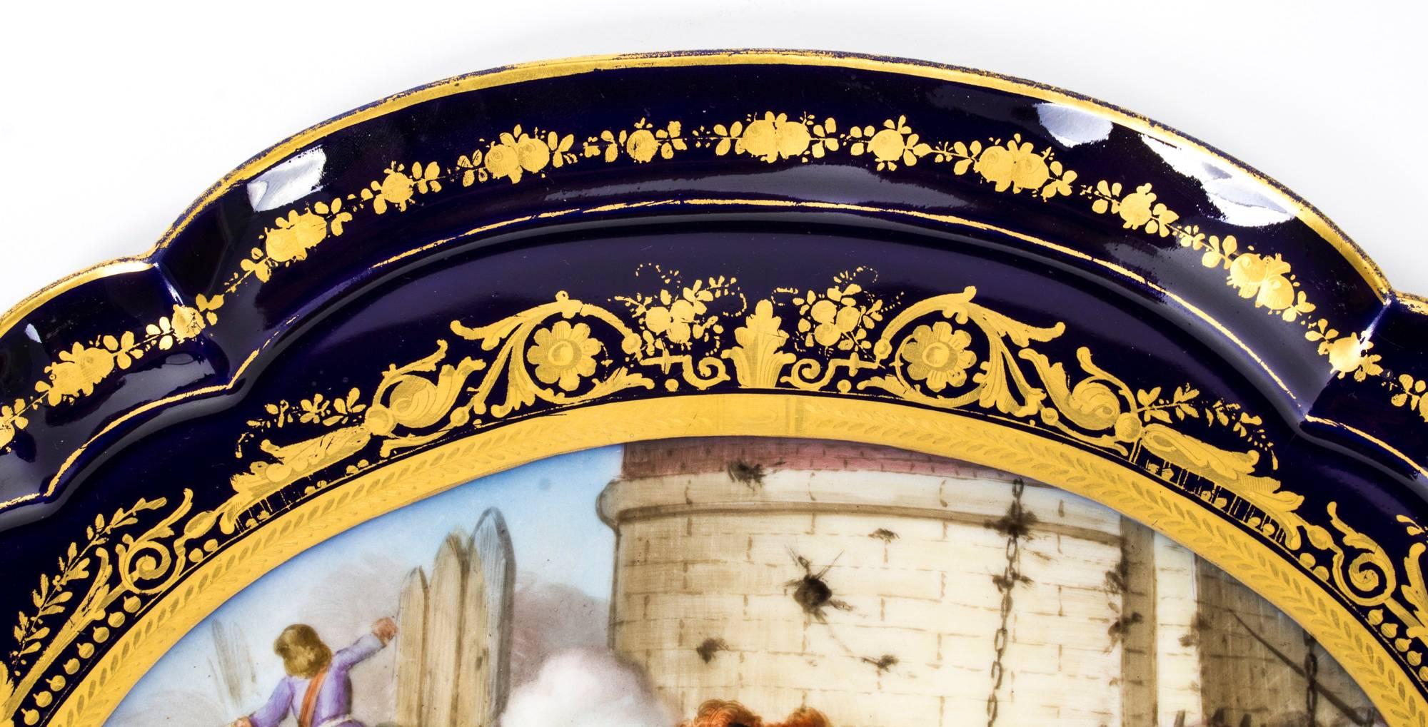 This is an absolutely fabulous antique Sevres porcelain oval two-handled tray, dating from the mid-19th century.

Beautifully hand-painted and commemorating a 1677 battle scene, the 