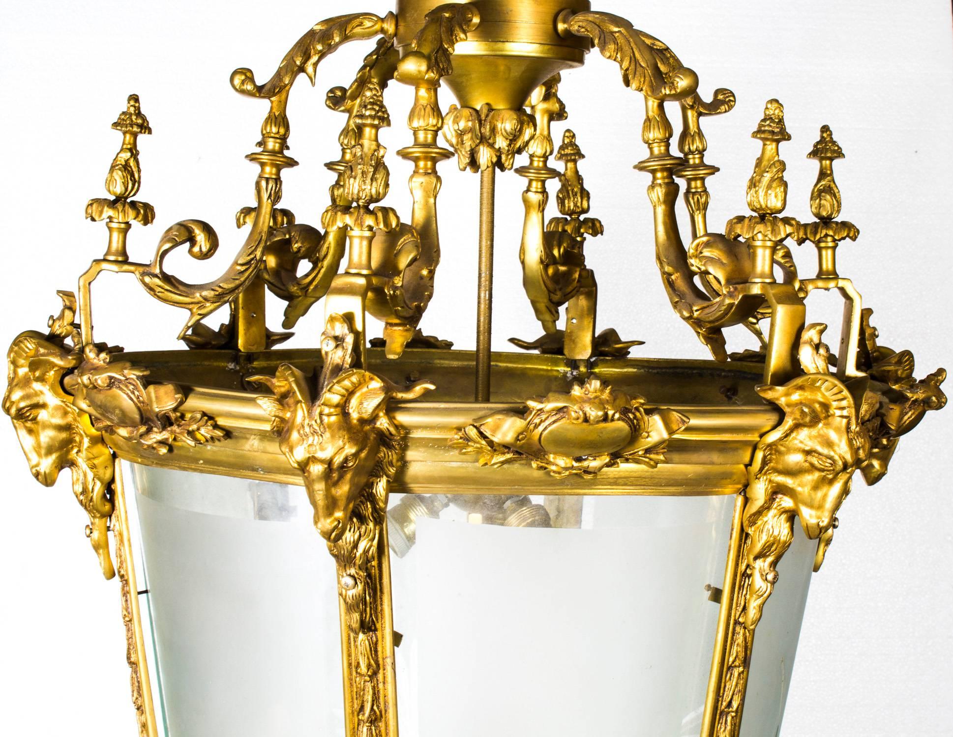 An exceptional and impressive huge gilt bronze six light hall lantern, dating from the last quarter of the 20th century.

This superb decorative lantern is finely cast and chiseled in solid bronze, of tapered form, the shaped brackets supporting