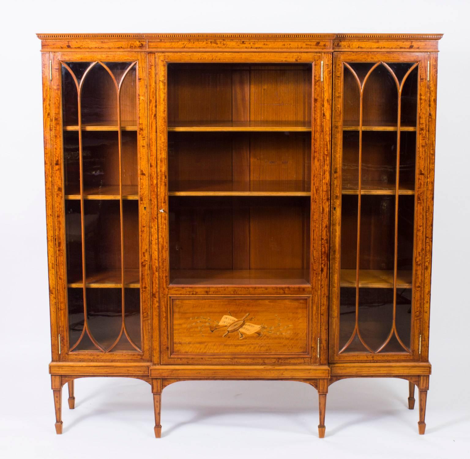 This is a superb antique late Victorian satinwood display cabinet, circa 1880 in date.

Oozing sophistication and charm, this cabinet is the absolute epitome of Victorian high society. Its attention to detail and lavish decoration are certain to