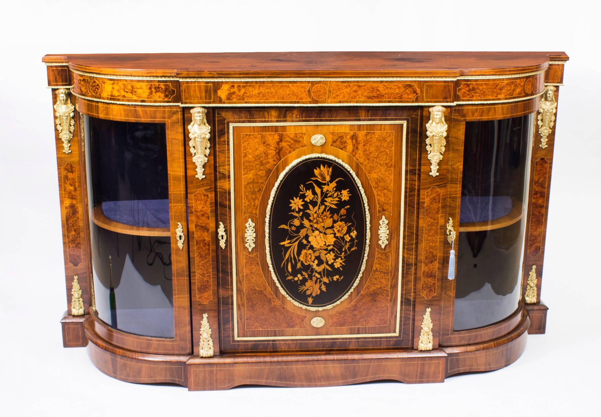 This is a superb antique Victorian burr walnut and marquetry inlaid credenza, circa 1850 in date.

Oozing sophistication and charm, this credenza is the absolute epitome of Victorian high society. Its attention to detail and lavish decoration are