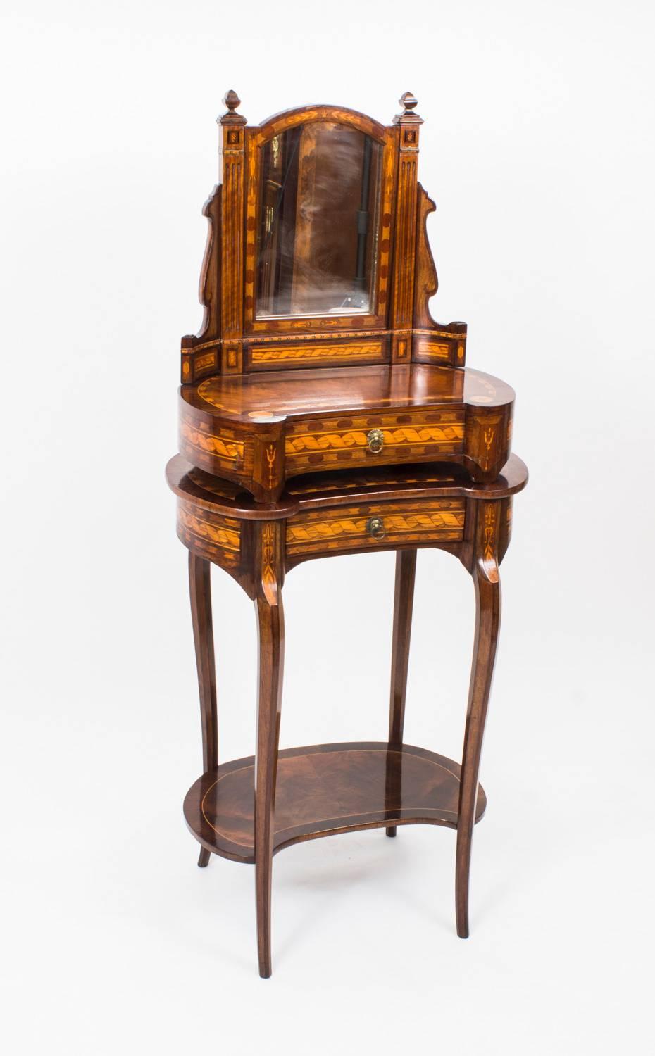 This is a beautiful antique French walnut marquetry kidney shaped occasional table and dressing table mirror set, circa 1860 in date.

Both pieces have been masterfully crafted from beautiful burr walnut with rosewood and marquetry banding, they