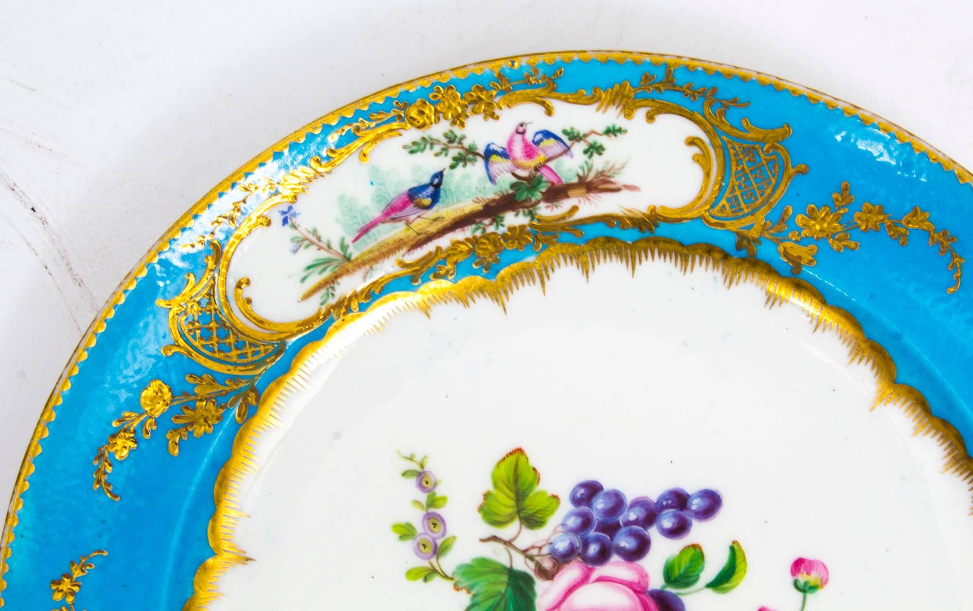 This is an absolutely fabulous decorative antique pair of Sevres porcelain cabinet plates dating from the 18th Century.

They have striking Bleu Celeste and gilt tooled borders each with three gilt reserves painted with exotic birds, and the