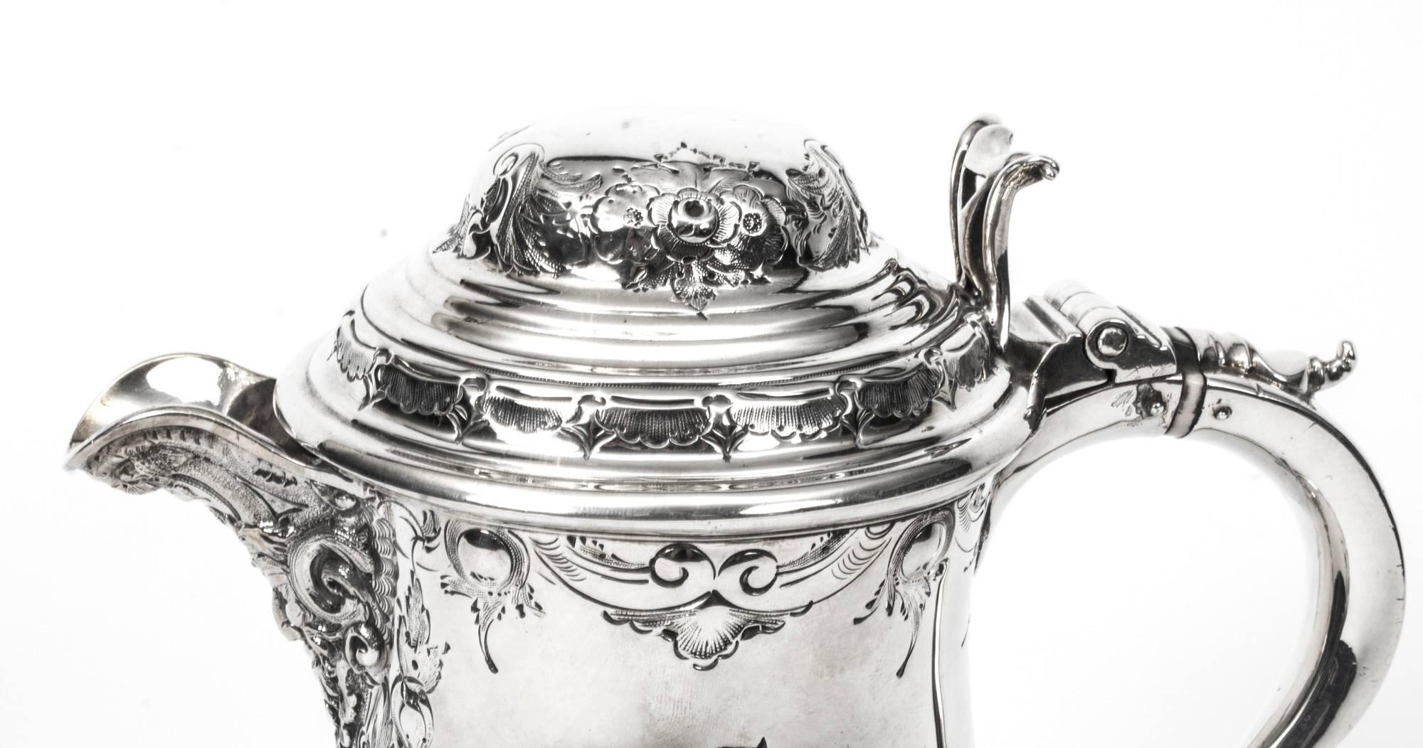 A very attractive silver plate ewer in the Classic English style with fabulous engraved and embossed decoration, C1860 in date and bearing the makers mark of the renowned silversmiths Martin Hall & Co.

The underside makers mark anf the