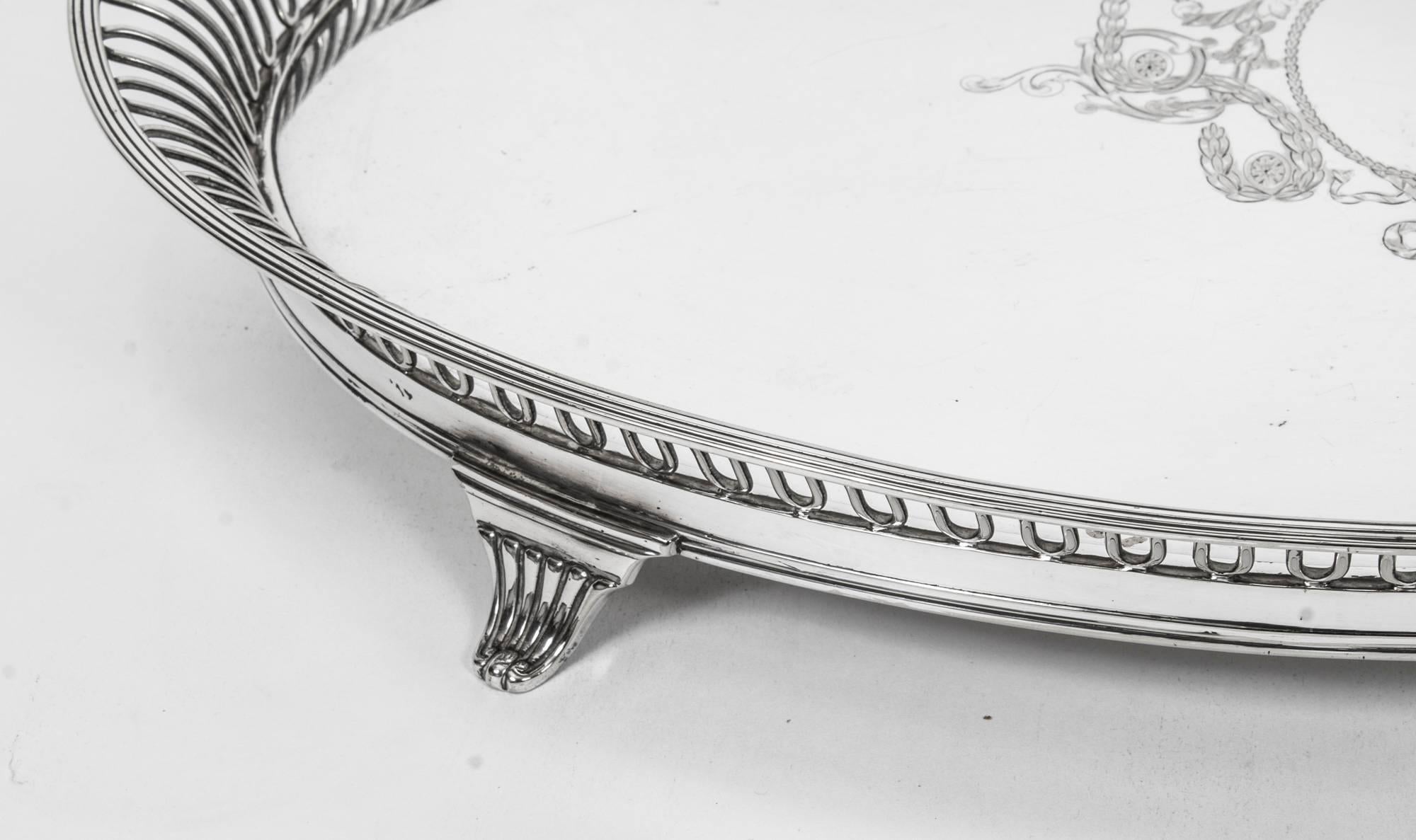 This is an exceptional antique English Victorian silver plated oval tray with a beautiful galleried border,

circa 1880 in date and bearing the makers marks of the renowned silversmiths Elkington & Co.
This magnificent tea tray is one of the