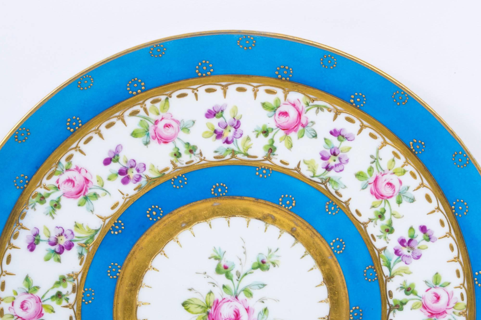 This is a beautiful antique "Bleu Celeste" Sevres porcelain cabinet plate, circa 1880 in date.

It has superb tooled gilding and is enamelled with roses and violets.
on.

It bears the interlaced L's mark for Sevres on the