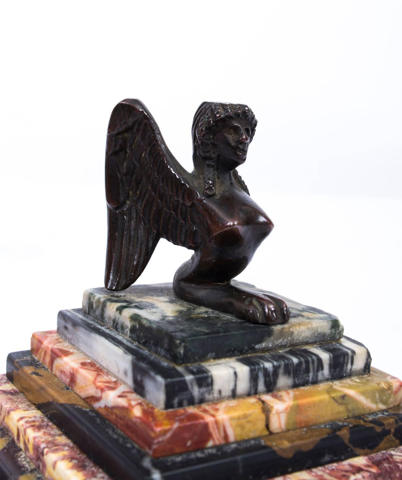This is a superb antique 19th century French paperweight with a bronze model of a harpy raised on a stepped specimen marble plinth, also dating from the mid-19th century.
In Greek and Roman mythology a harpy is a rapacious monster described as
