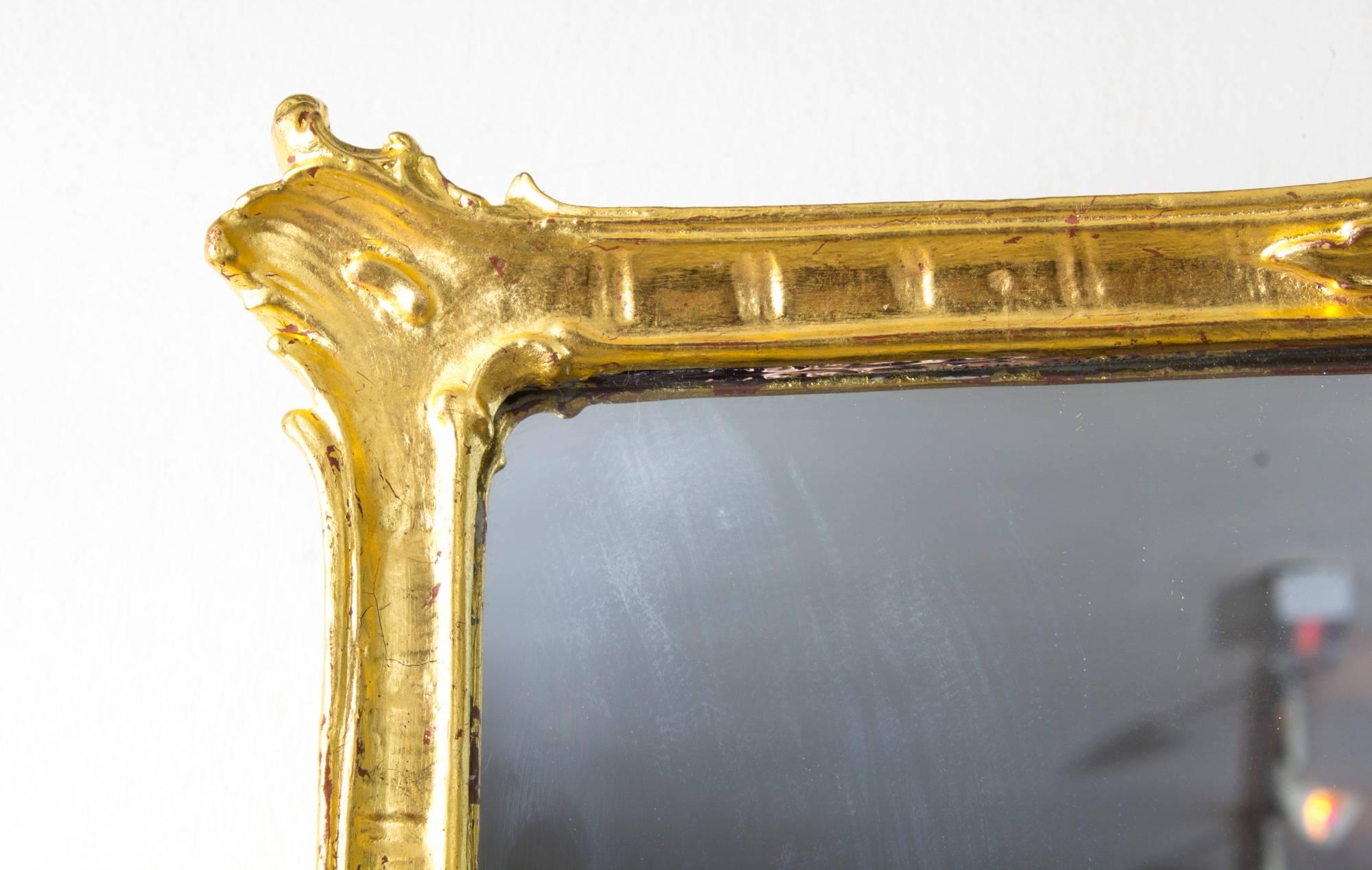 This is a beautiful antique Victorian giltwood mirror, circa 1860 in date.

Gushing with beauty, elegance and refinement, this mirror is the epitome of Victorian style. It is certain to make a charming addition to that one special room in your
