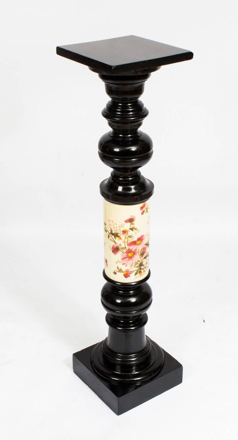 This is a gorgeous pair of large antique ebonised and porcelain pedestals, circa 1880 in date.

The pedestals feature elaborately turned ebonised wood capitals and bases, with a porcelain shaft decorated with foliate and floral motifs.

Perfect for